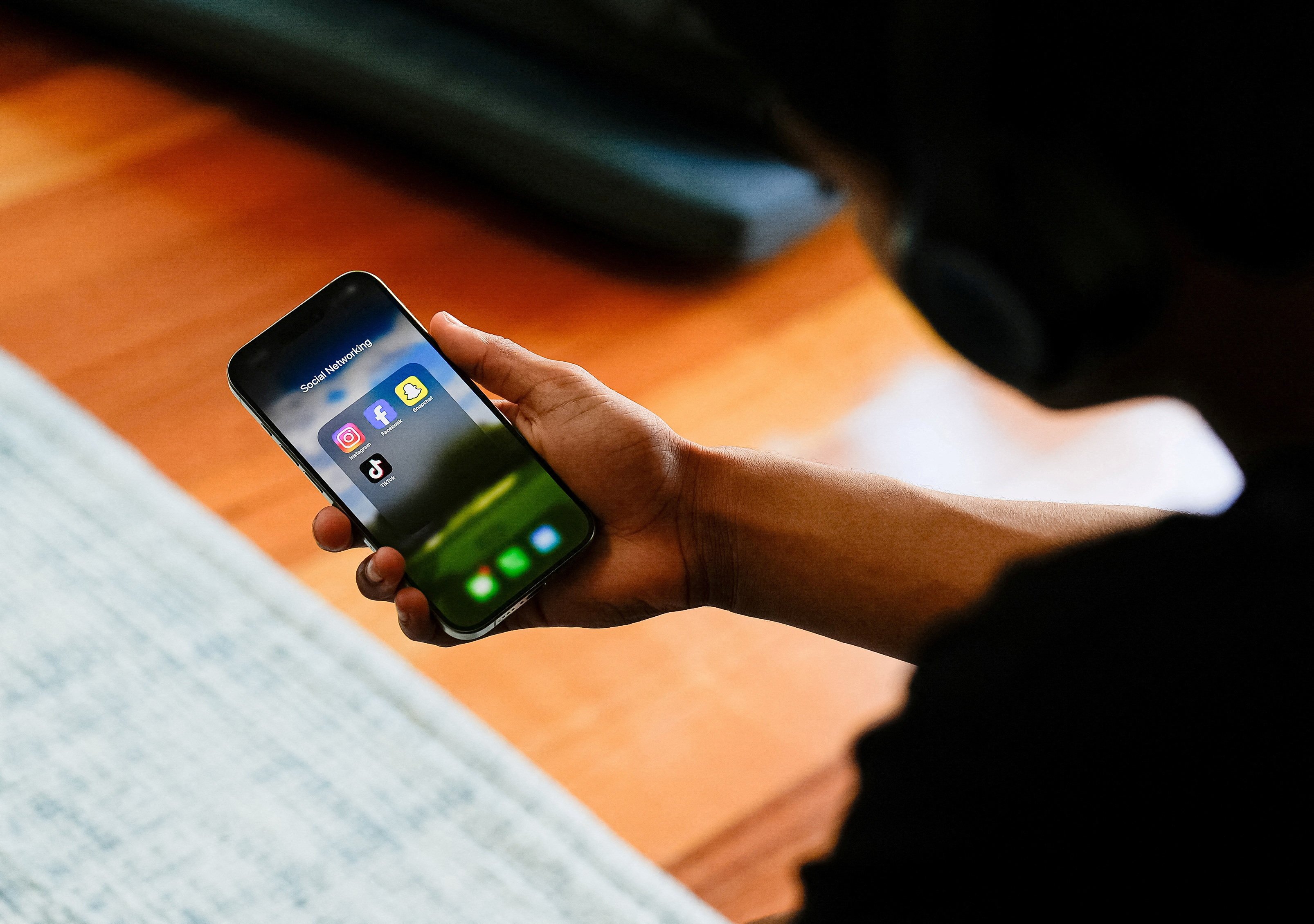 Australia plans to trial an age-verification system that may include biometrics or government identification to enforce the ban. Photo: Reuters