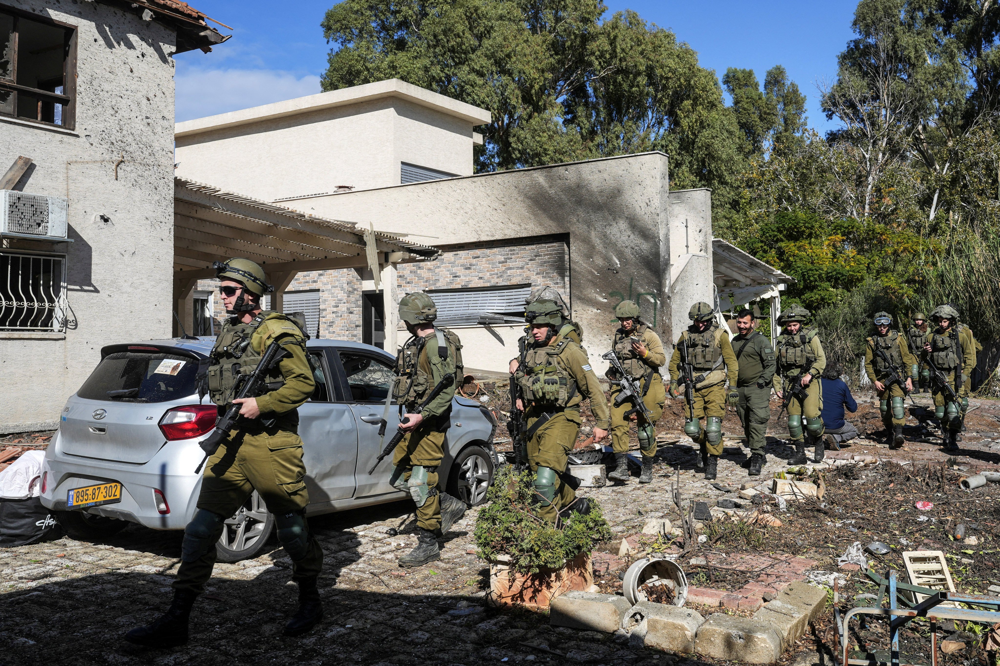 Israeli soldiers visit the site where a house was damaged, after projectiles were fired across over to Israel from Lebanon. Photo: Reuters