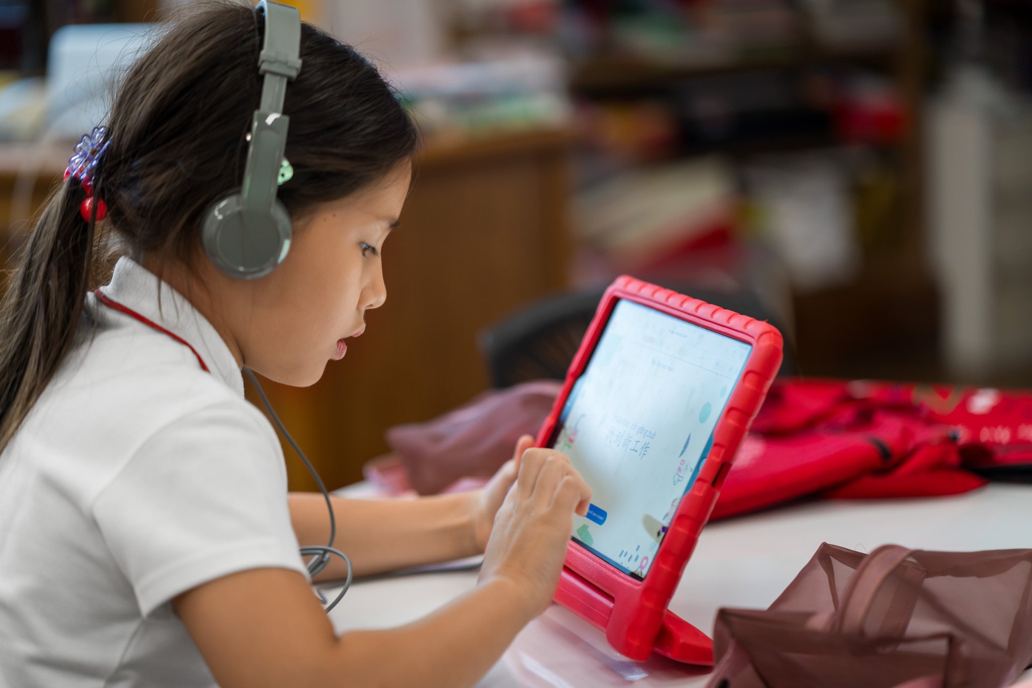 Canadian International School pupils use tech in class. Photo: CDNIS