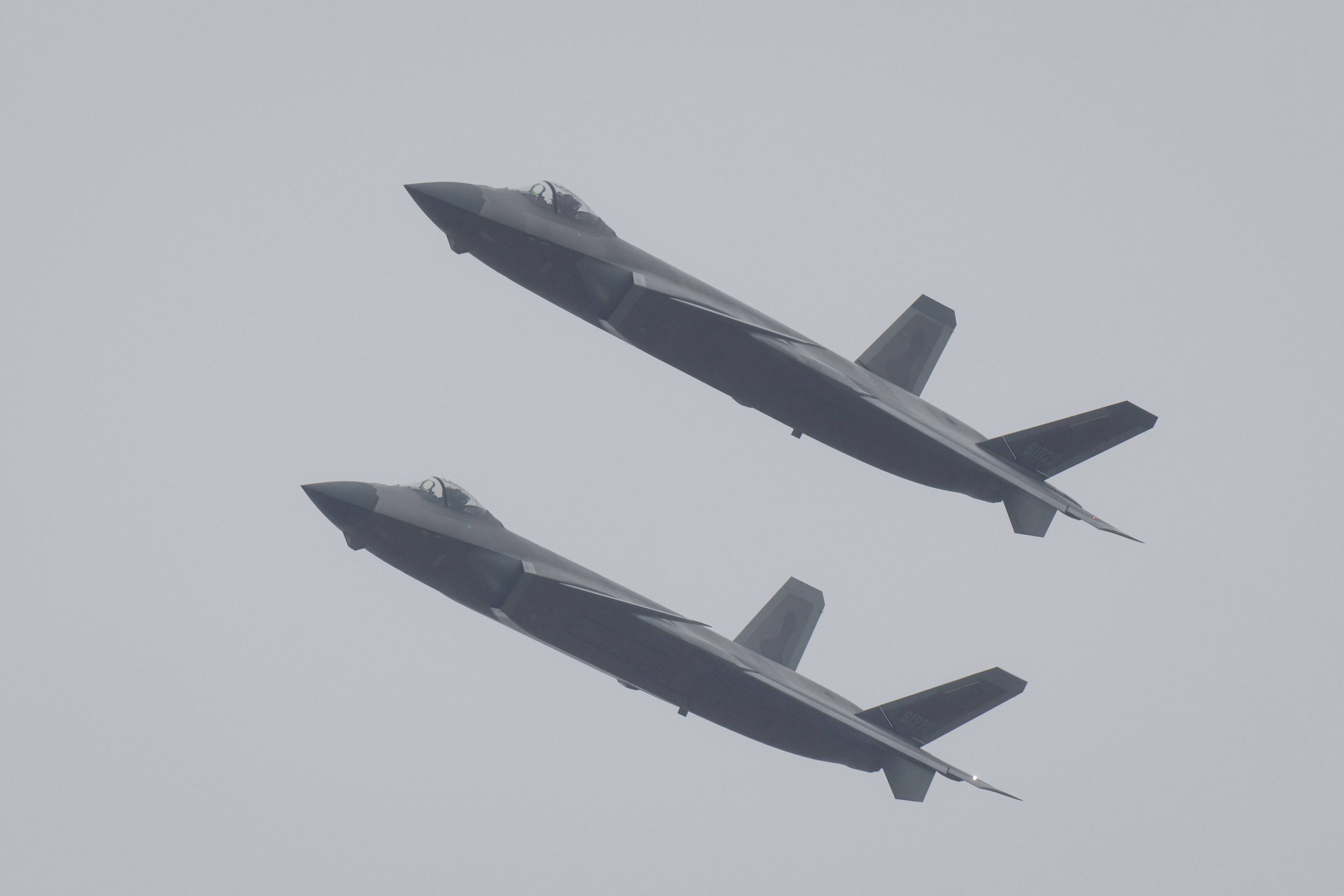 Chinese military researchers have pitted the Chinese J-20 stealth fighter - seen here during the recent China Airshow - against an American F-22 in a simulated battle to see who would be victorious. Photo: AFP