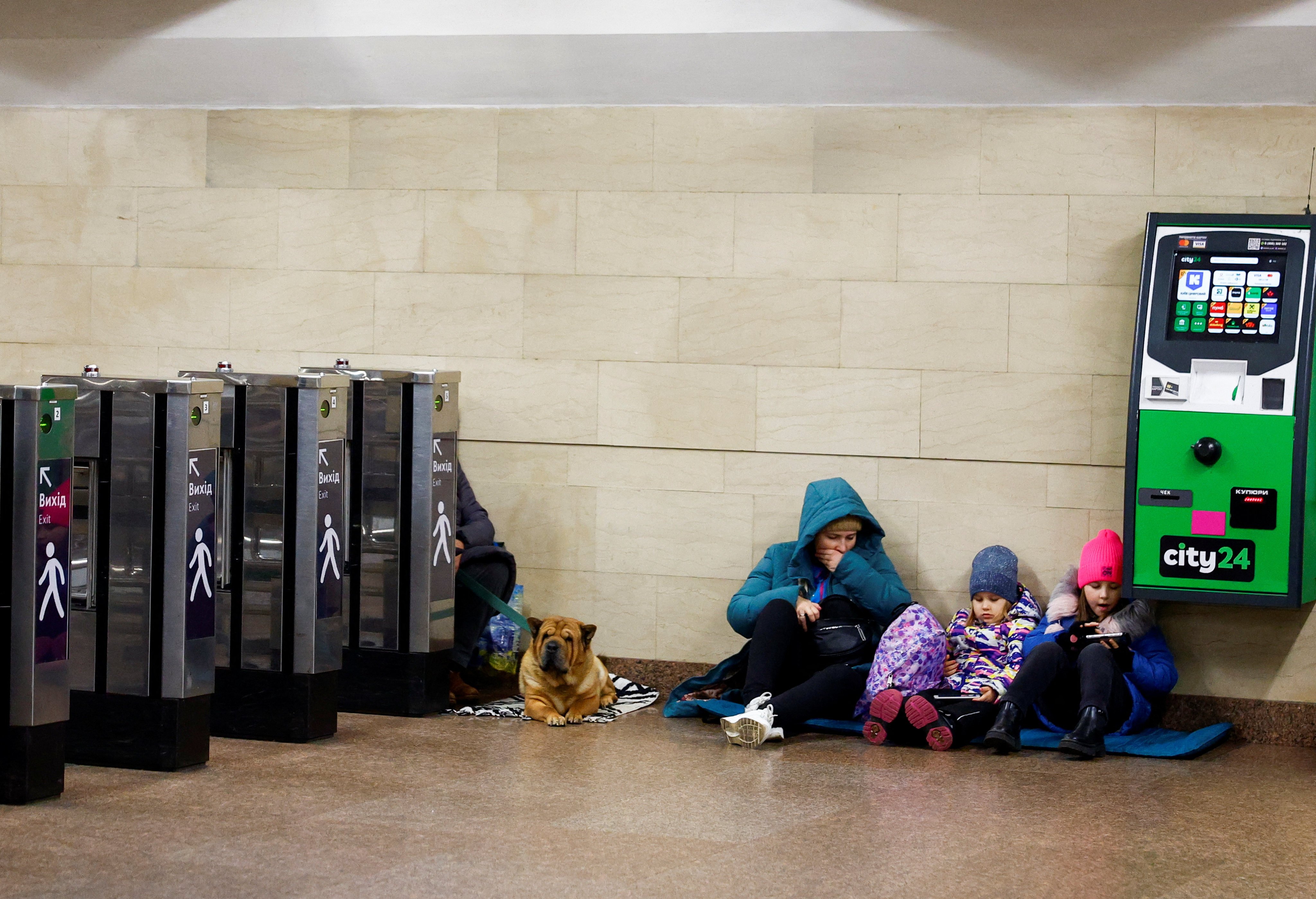 People take shelter inside a Kyiv metro station during a Russian attack. Photo: Reuters