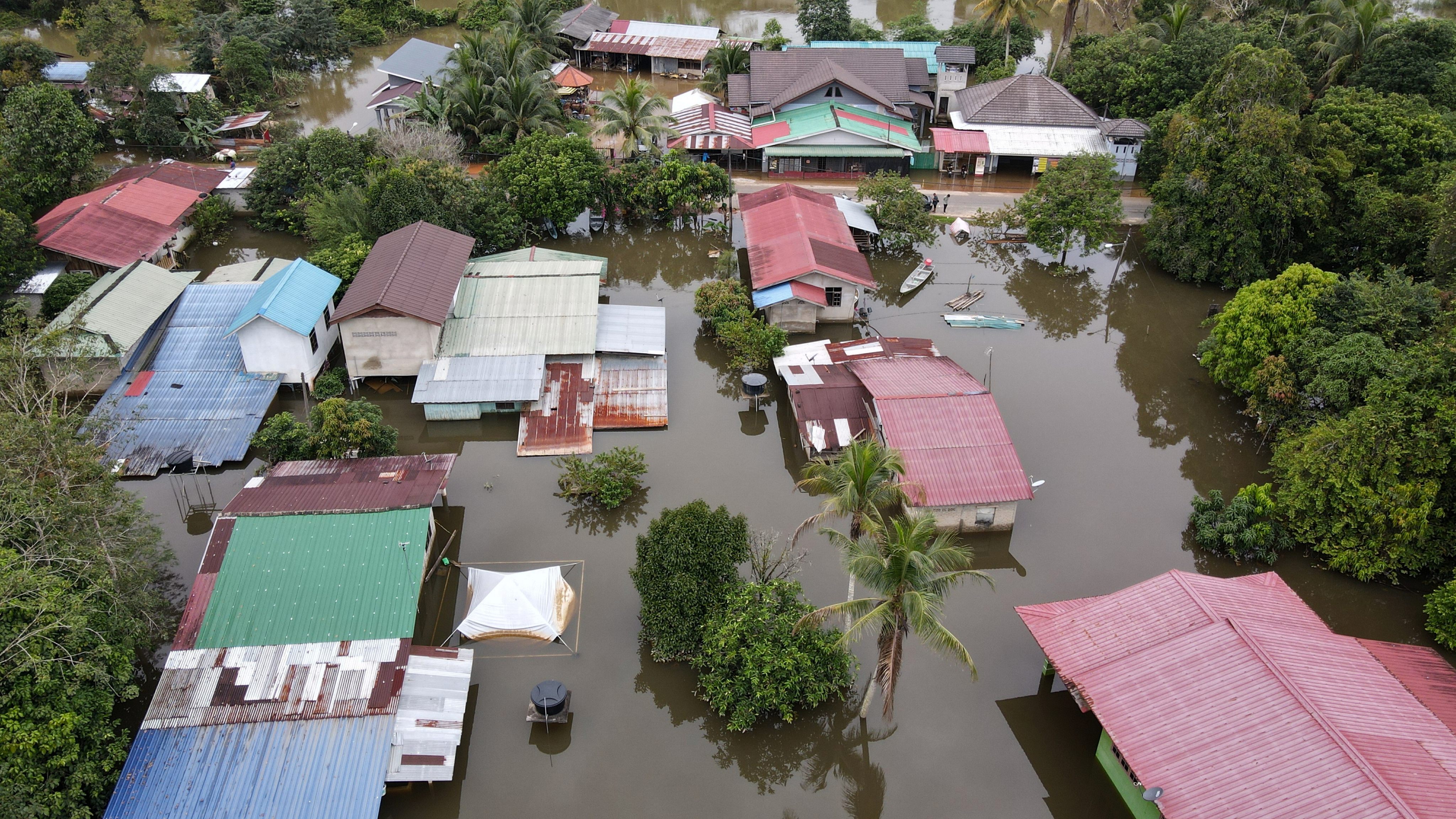 A file photo of flooded houses in Tersang village in Rantau Panjang town on December 15, 2022. Photo: dpa/file