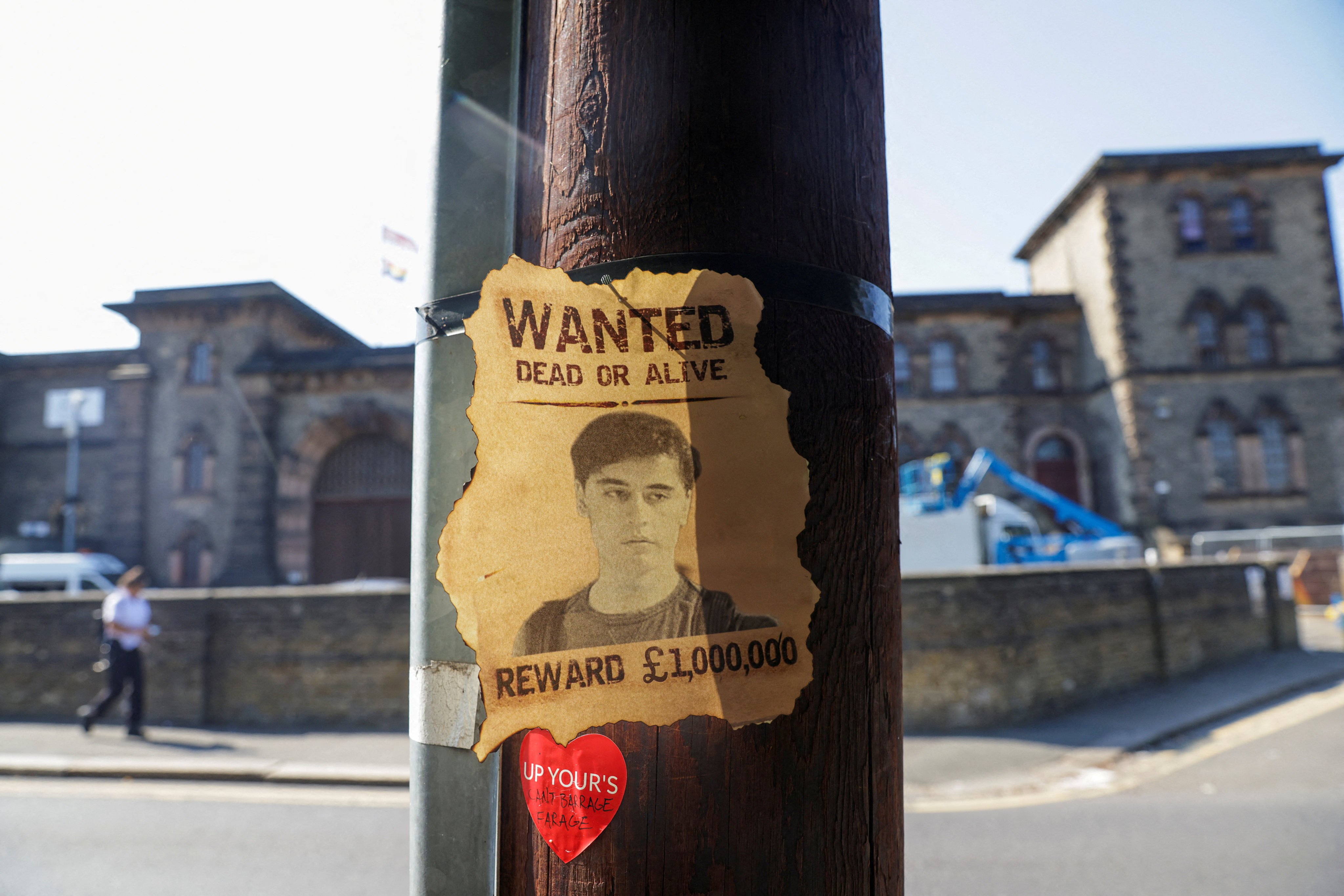 A wanted sign featuring an image of Daniel Abed Khalife is displayed near Wandsworth prison in London. Photo: Reuters