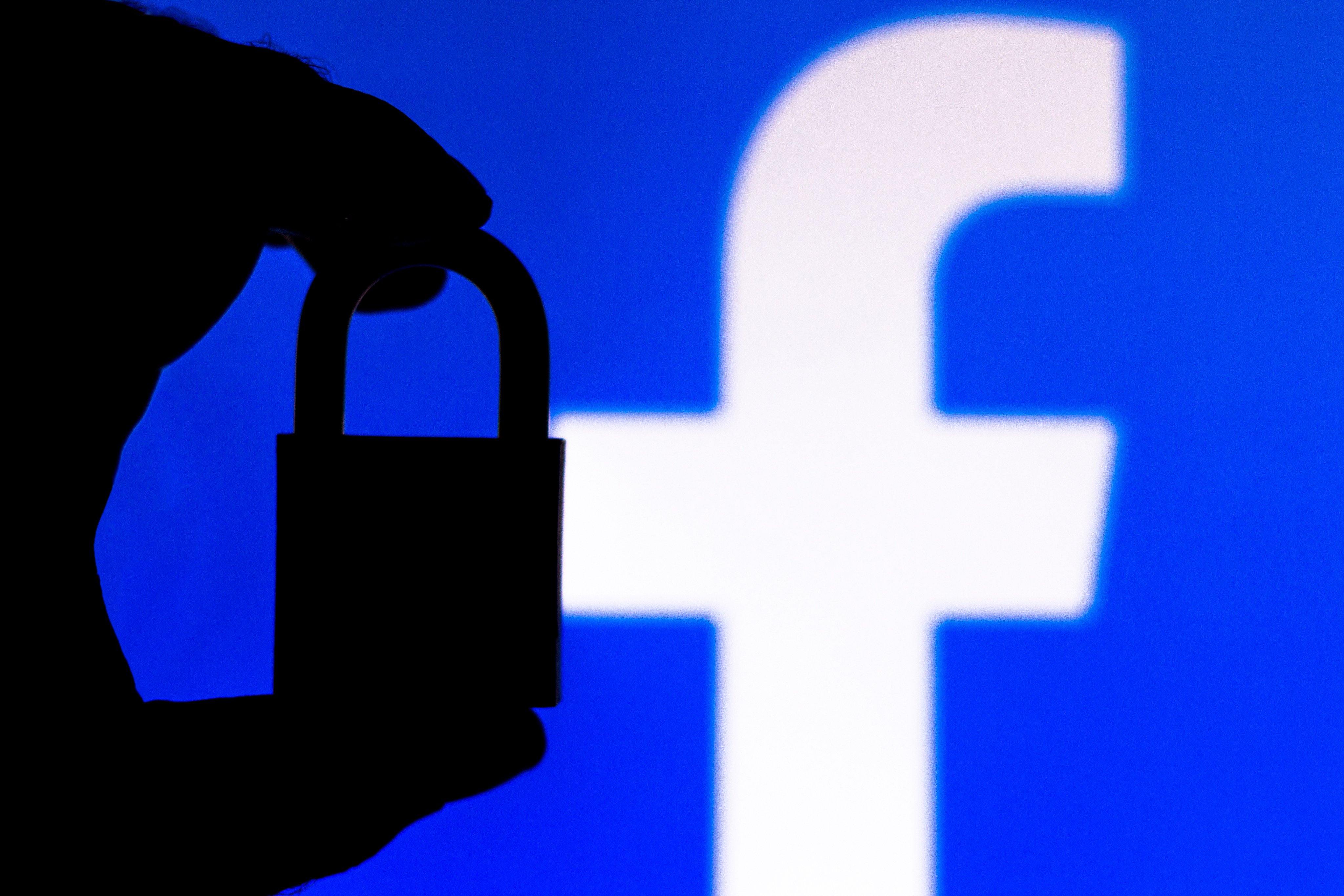 A padlock appears next to the Facebook logo. Photo: Shutterstock