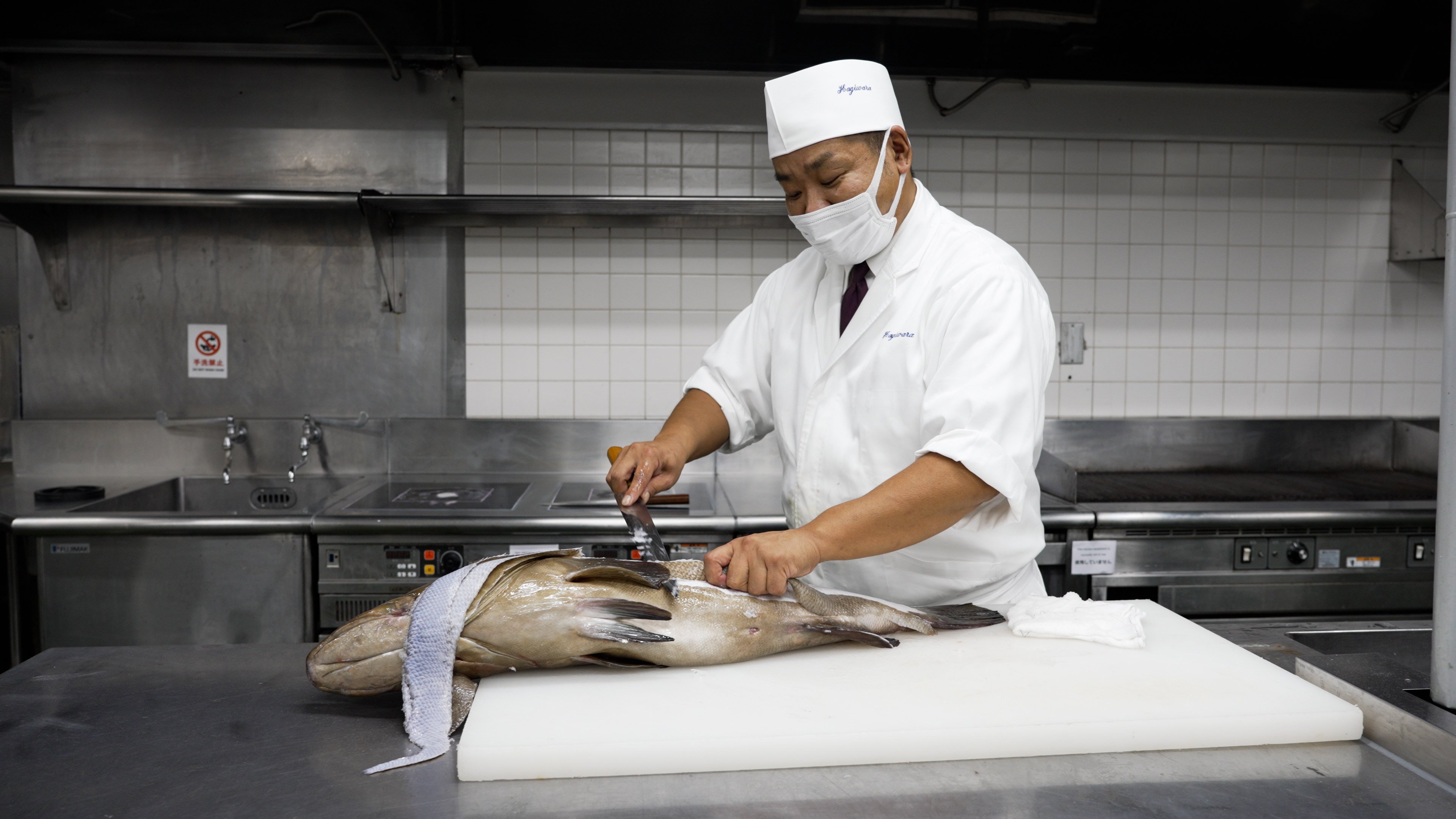 Fukuoka chef Kazutaka Hagiwara prepares longtooth grouper. Photo: Llewellyn Cheung