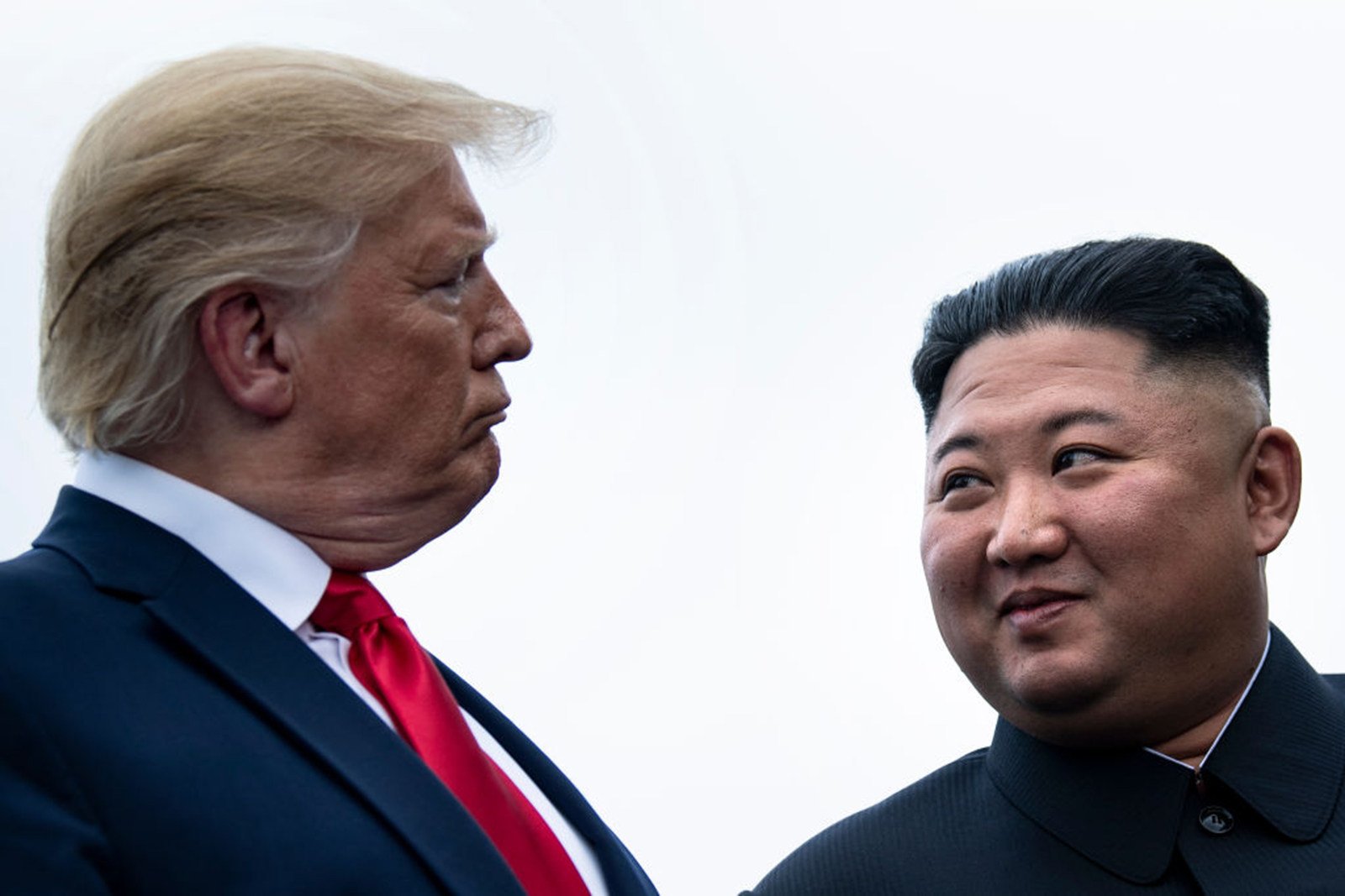 US President Donald Trump and North Korea’s leader Kim Jong-un talk before a meeting in June 2019 in Panmunjom. Photo: AFP via Getty Images/TNS