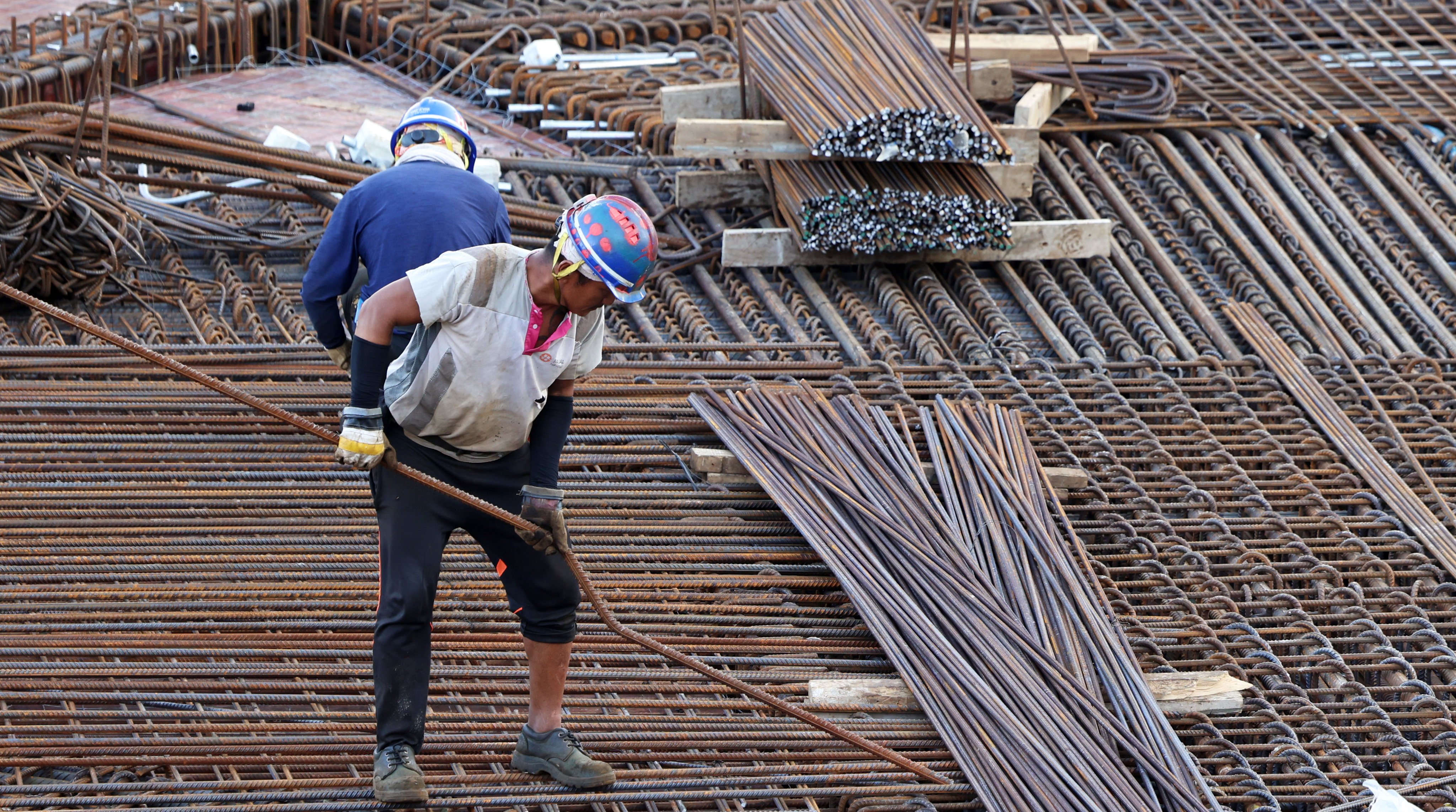 Construction workers on a site in Central. Photo: Jelly Tse 