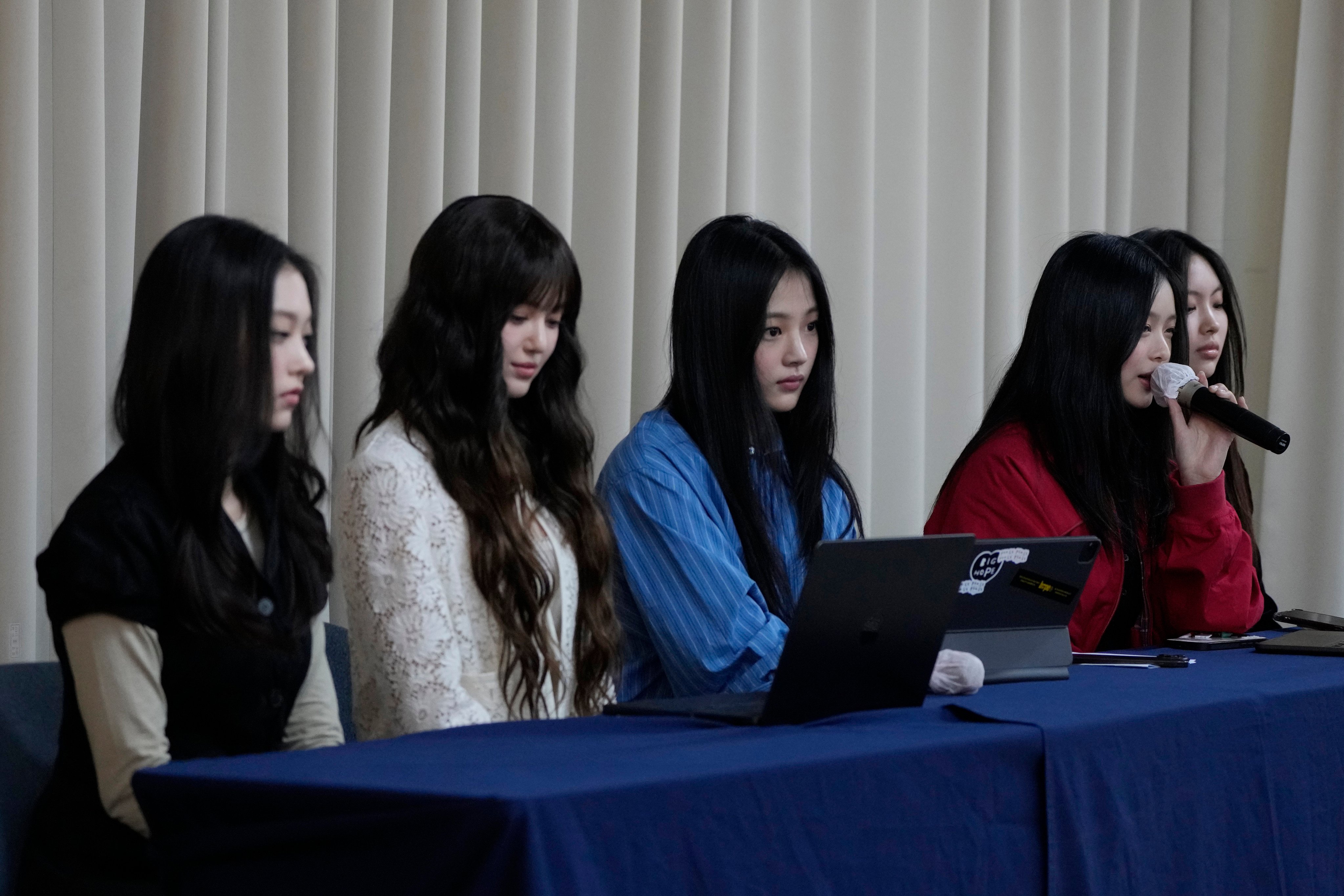 Members of NewJeans attend a press conference in Seoul to declare the termination of their contract with label Ador, citing multiple reasons including unfair treatment. Photo: AP