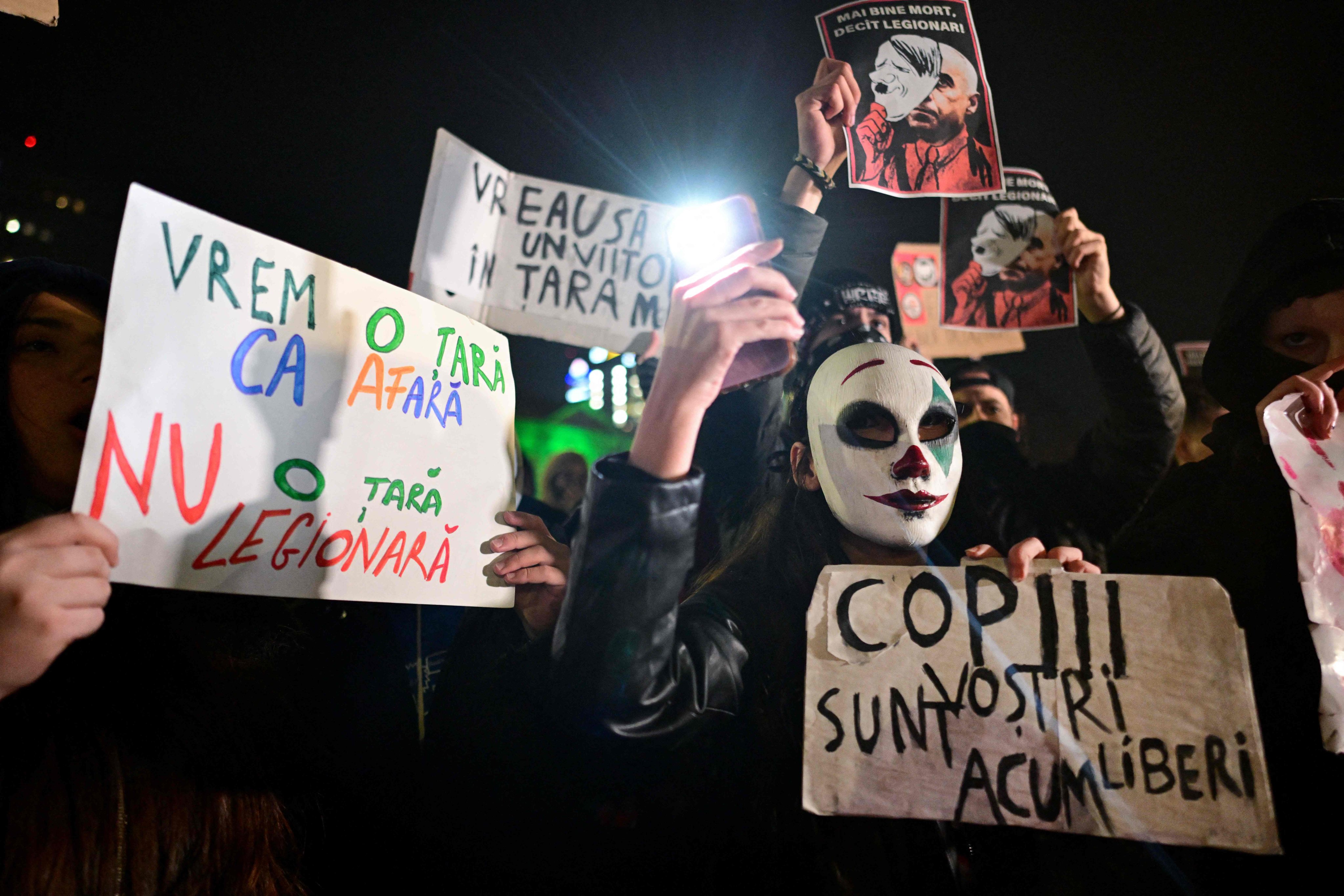 People protest in the front of the Palace of the Parliament at the Victory Square in Bucharest, Romania, on Wednesday. Photo: AFP