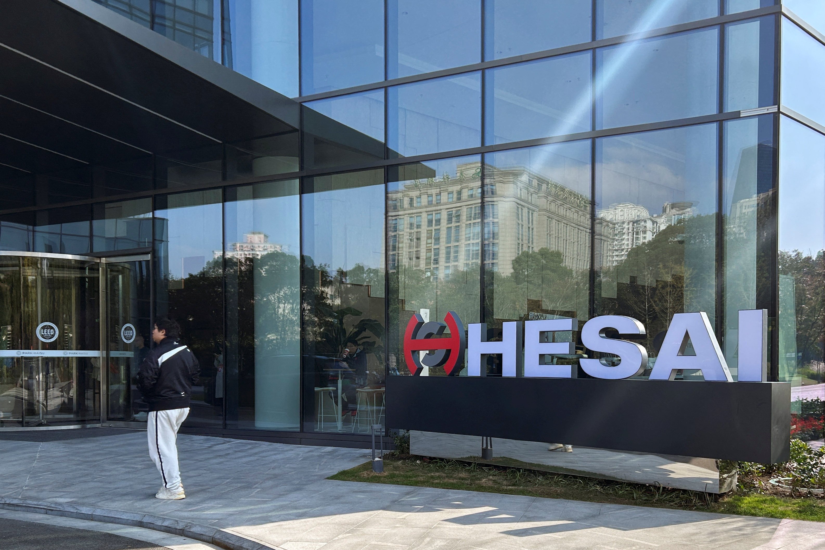 A person walks outside the headquarters of Hesai Group in Shanghai on November 26, 2024. Photo: Reuters