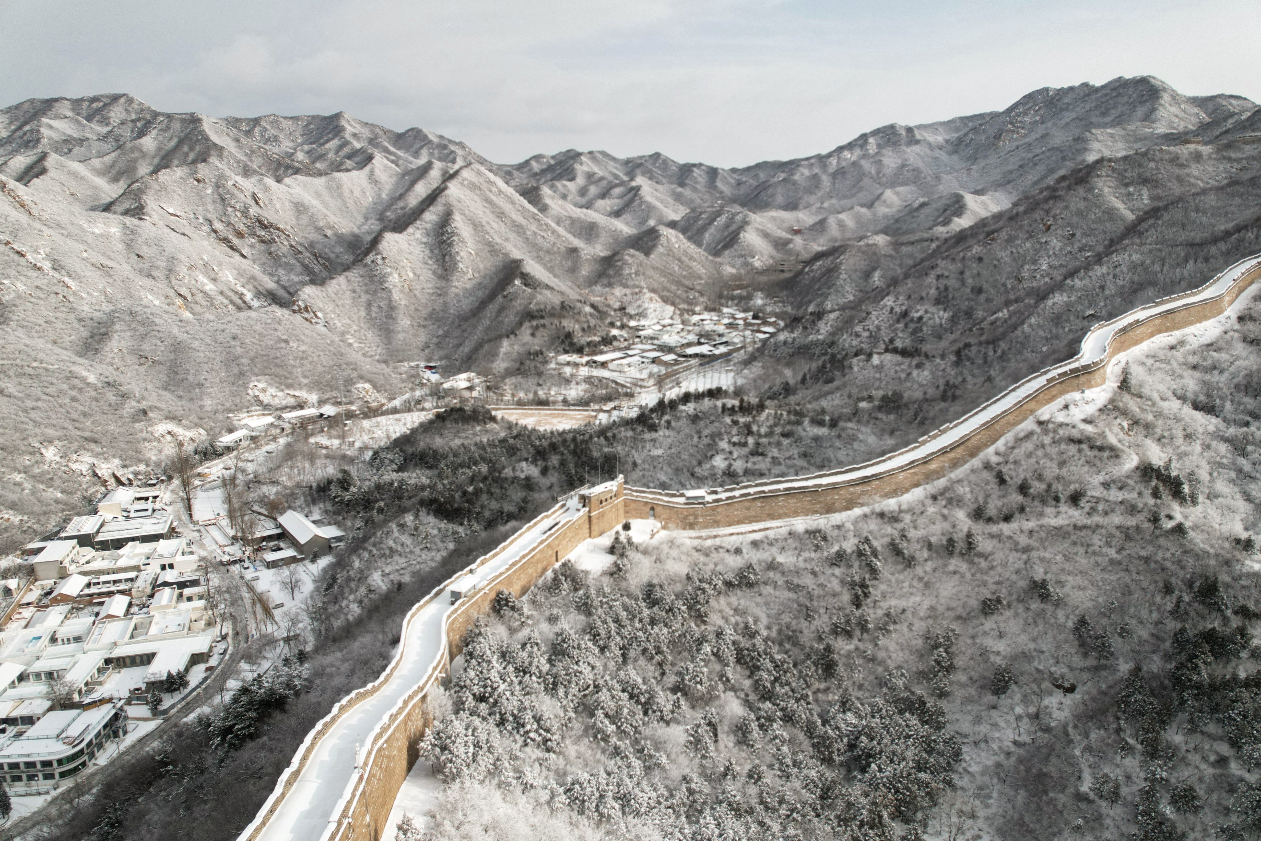 A section of the Great Wall of China north of Beijing. Like the incomplete border wall between the United States and Mexico, the Great Wall was built in sections that were later joined together to make a single barrier. Photo: AFP