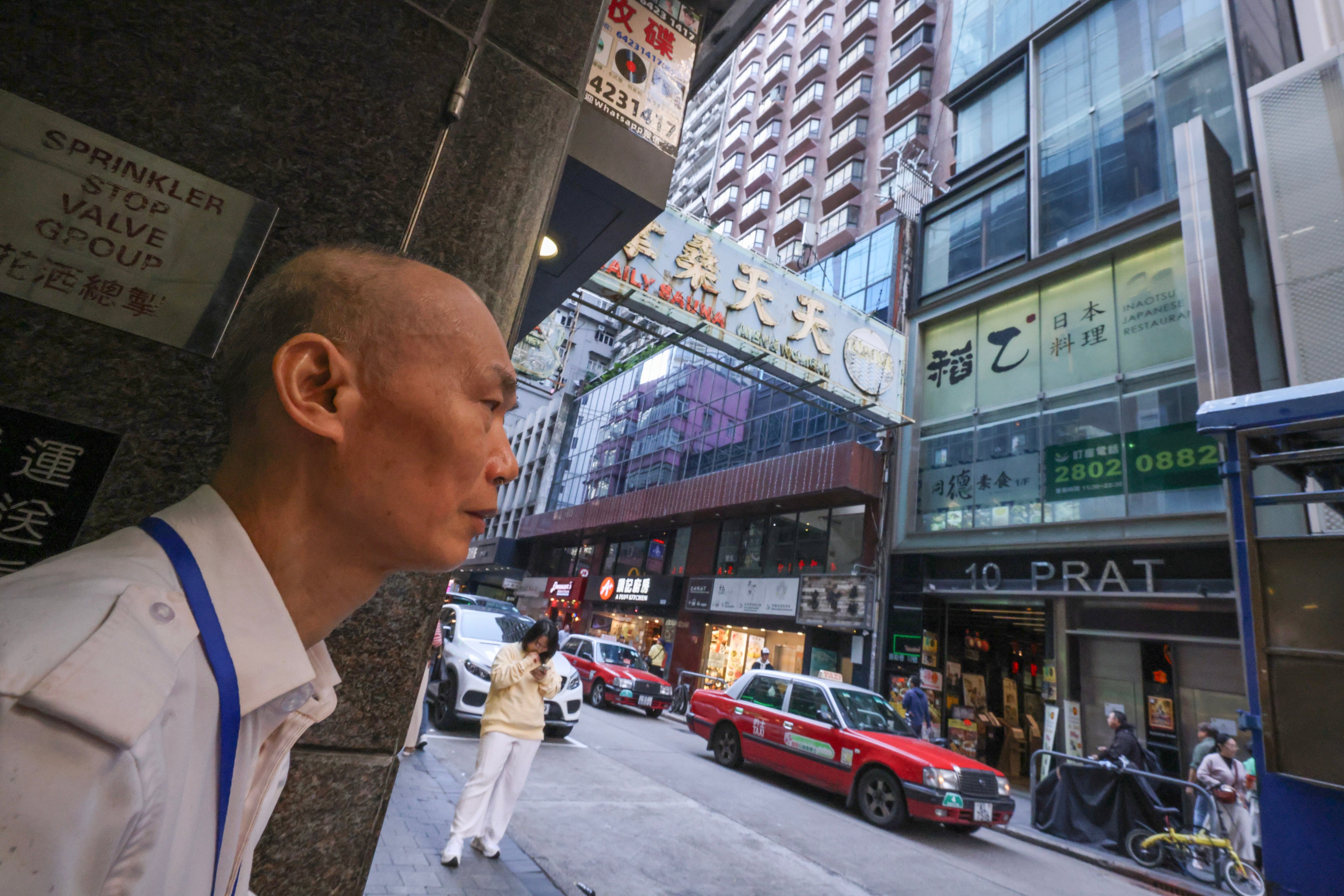 Security guard Chen Zhi-hao, now 68, has been stationed at Wardley Centre on Prat Avenue in Tsim Sha Tsui since 1992, just opposite where the Top One Karaoke bar once stood. Photo: Nora Tam