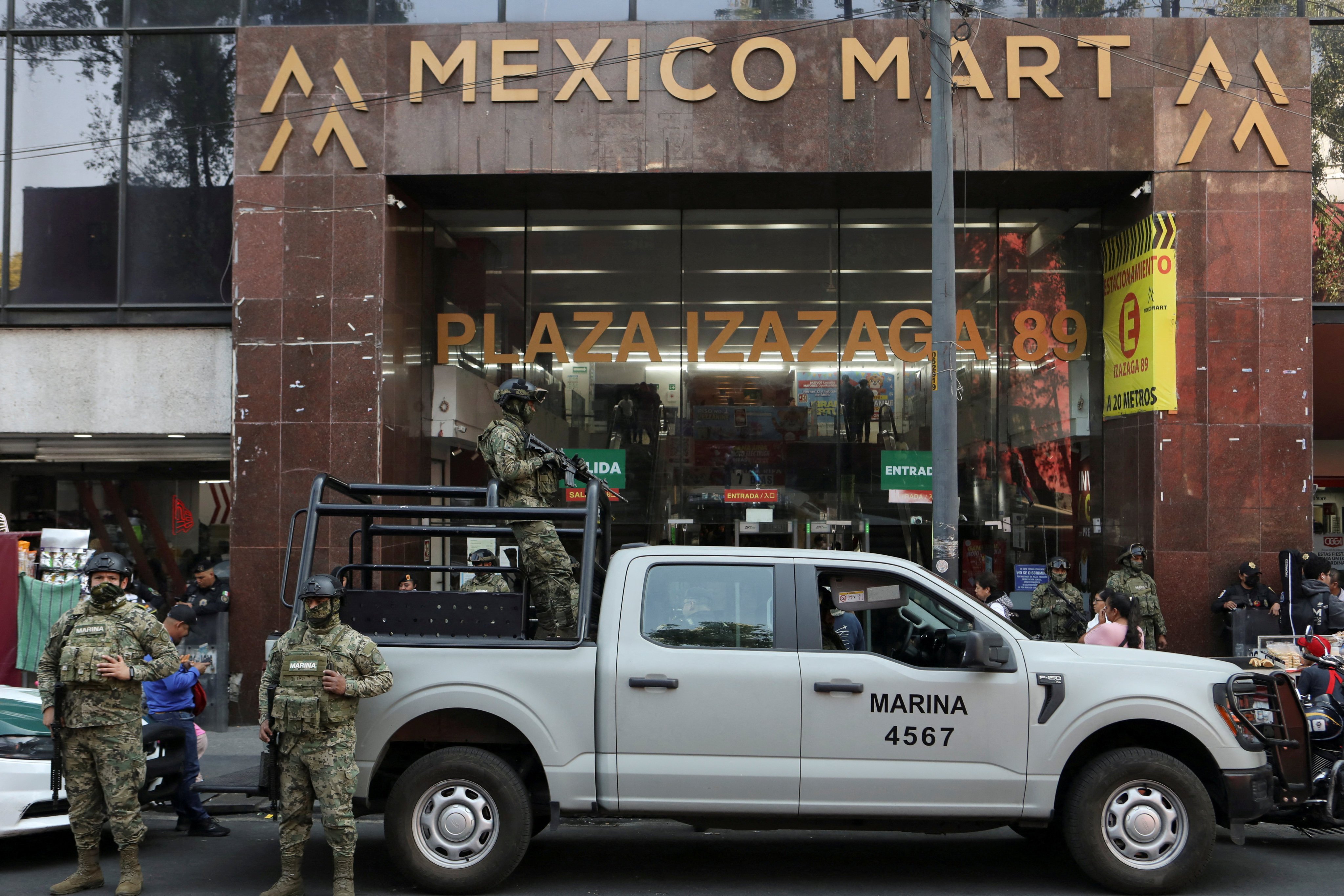 Members of the Mexican Navy keep watch outside the Mexico Mart shopping centre in Mexico City during an operation to seize Chinese counterfeit goods on Friday. Photo: Reuters