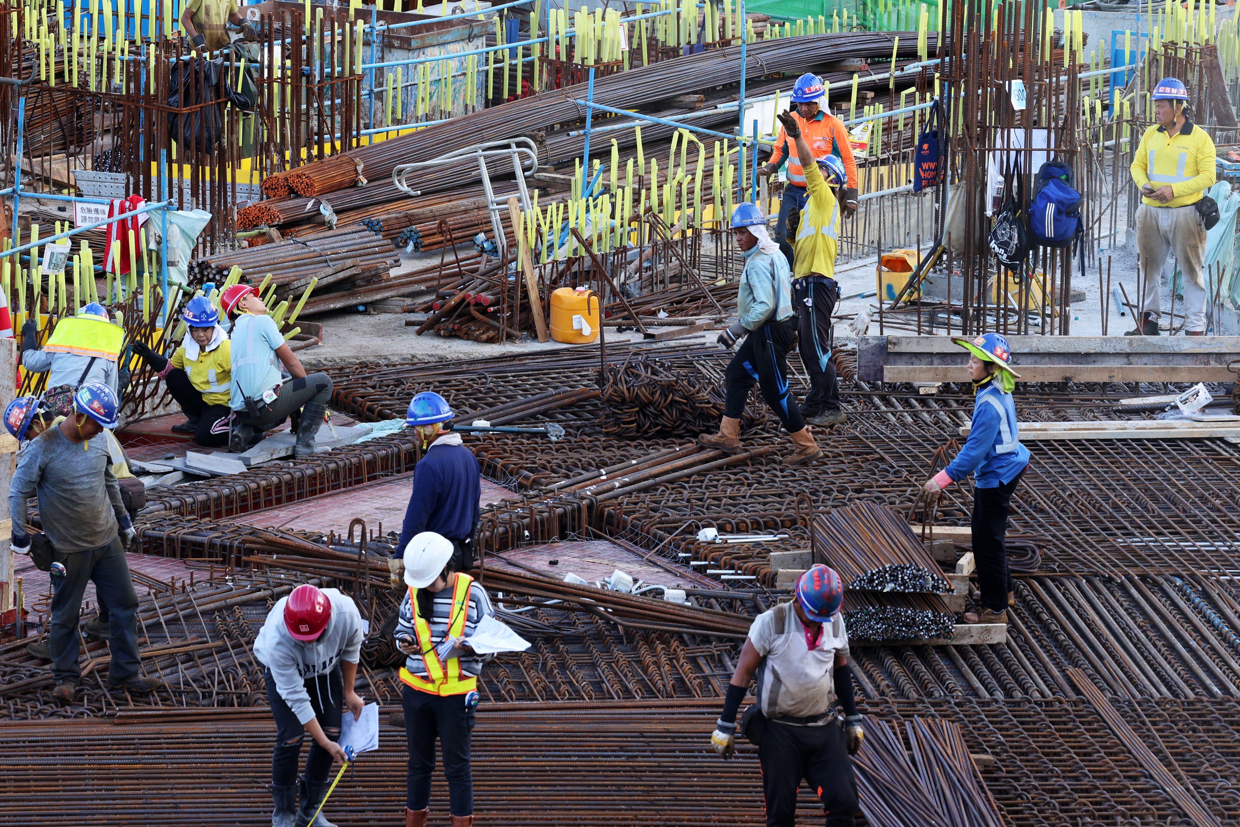 Workers at a construction site in Central. Photo: Jelly Tse