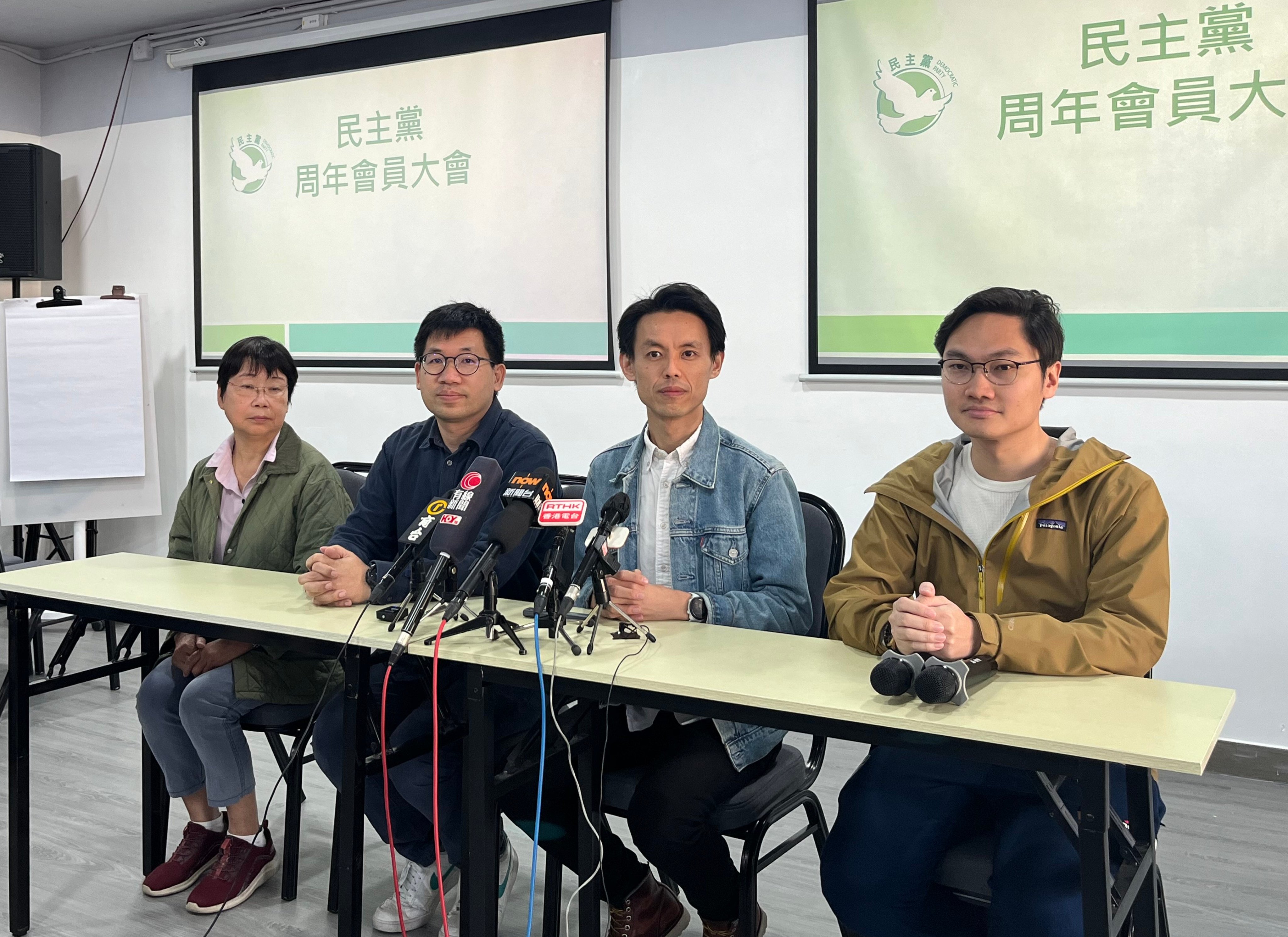 Lo Kin-hei (second from right) meets the press after his re-election. Photo: Emily Hung