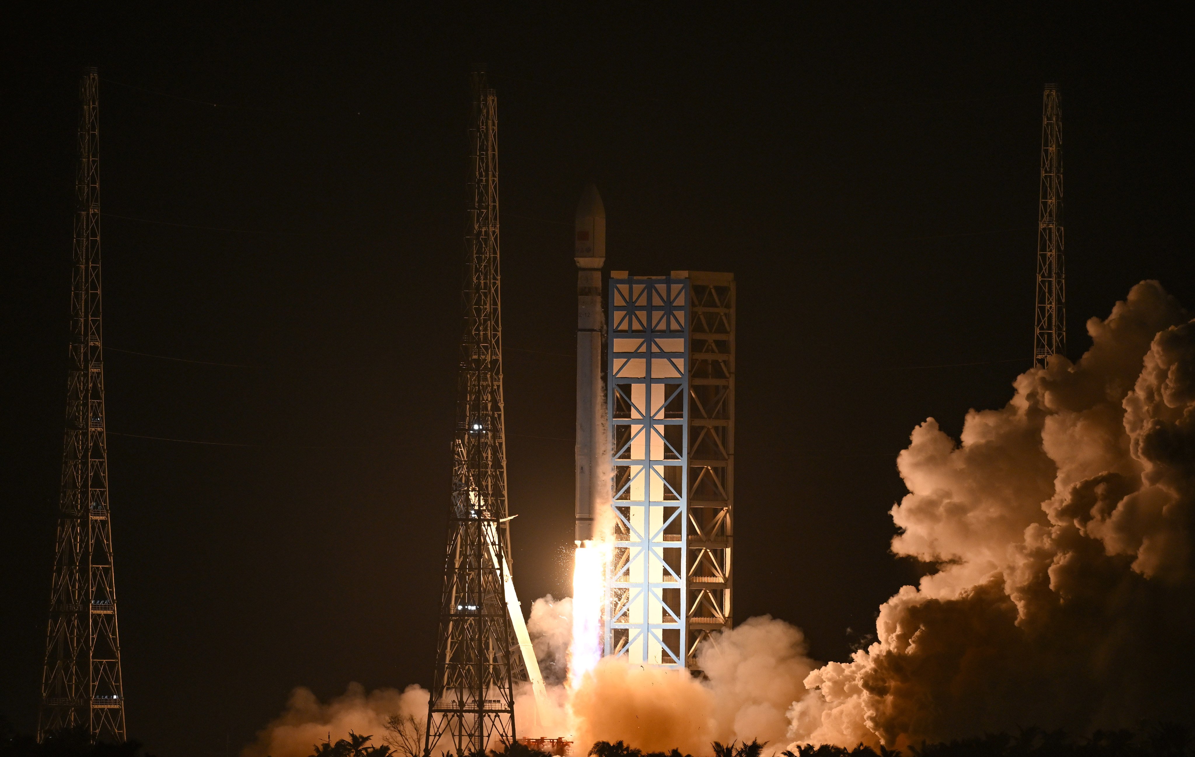 A Long March-12 rocket carrying two experimental satellites blasts off from the Hainan launch site on Saturday. Photo: Xinhua