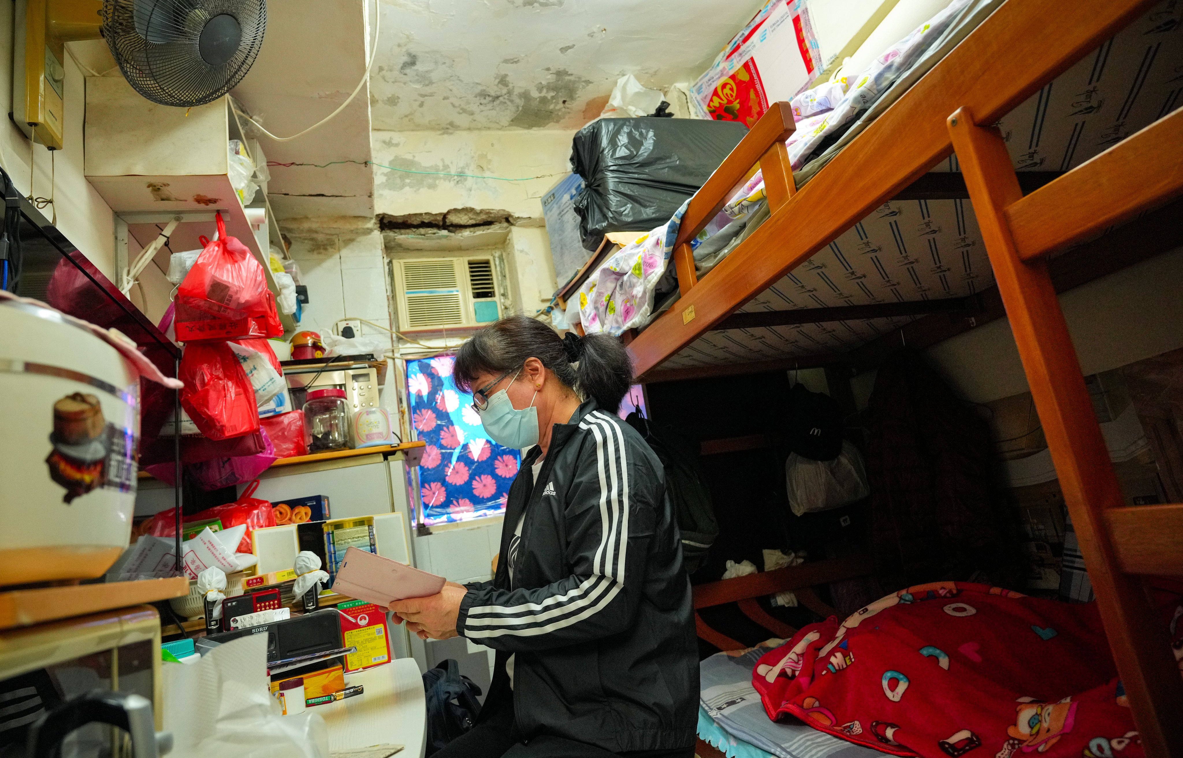 Wong Siu-mui pays HK$4,100 a month to rent her 70 sq ft subdivided home. Photo: May Tse