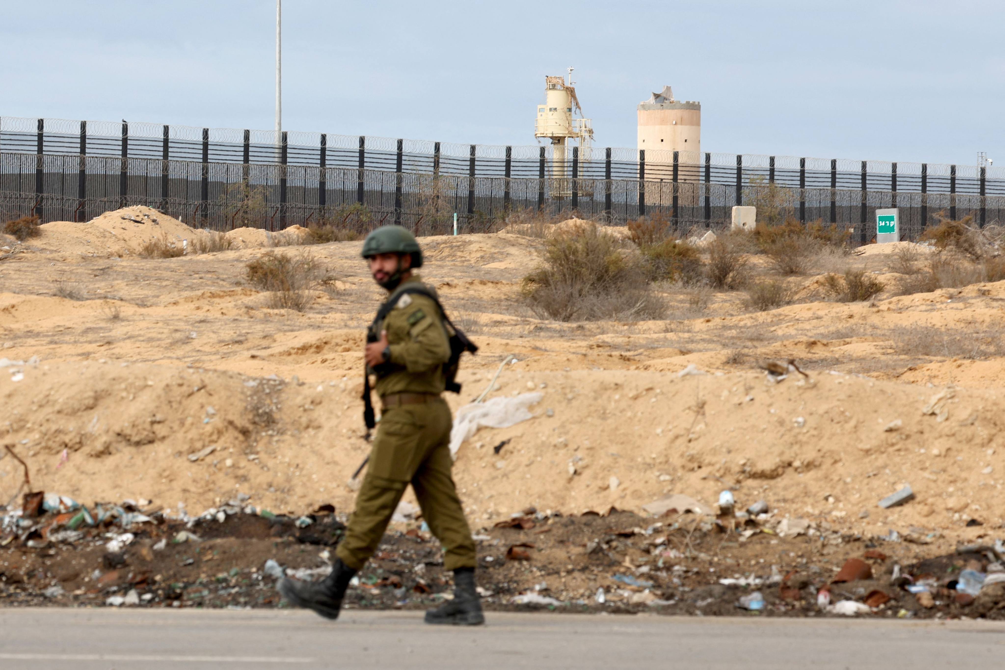 An Israeli soldier near the Kerem Shalom crossing, which has been the main artery for aid to Gaza since the Rafah crossing with Egypt was shut in May. Photo: AFP