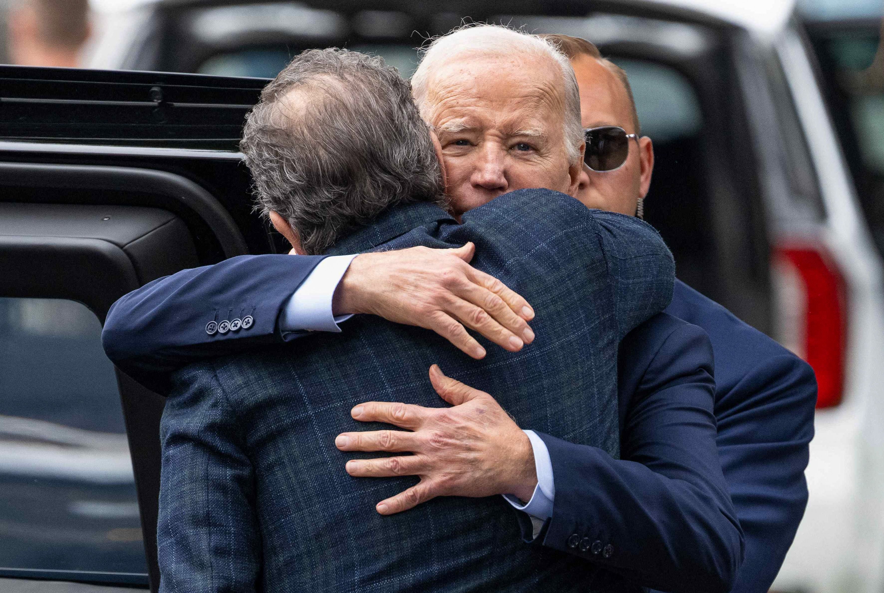 US President Joe Biden hugging Hunter Biden earlier this year. On Sunday, the US president issued an official pardon for his son. File photo: AFP