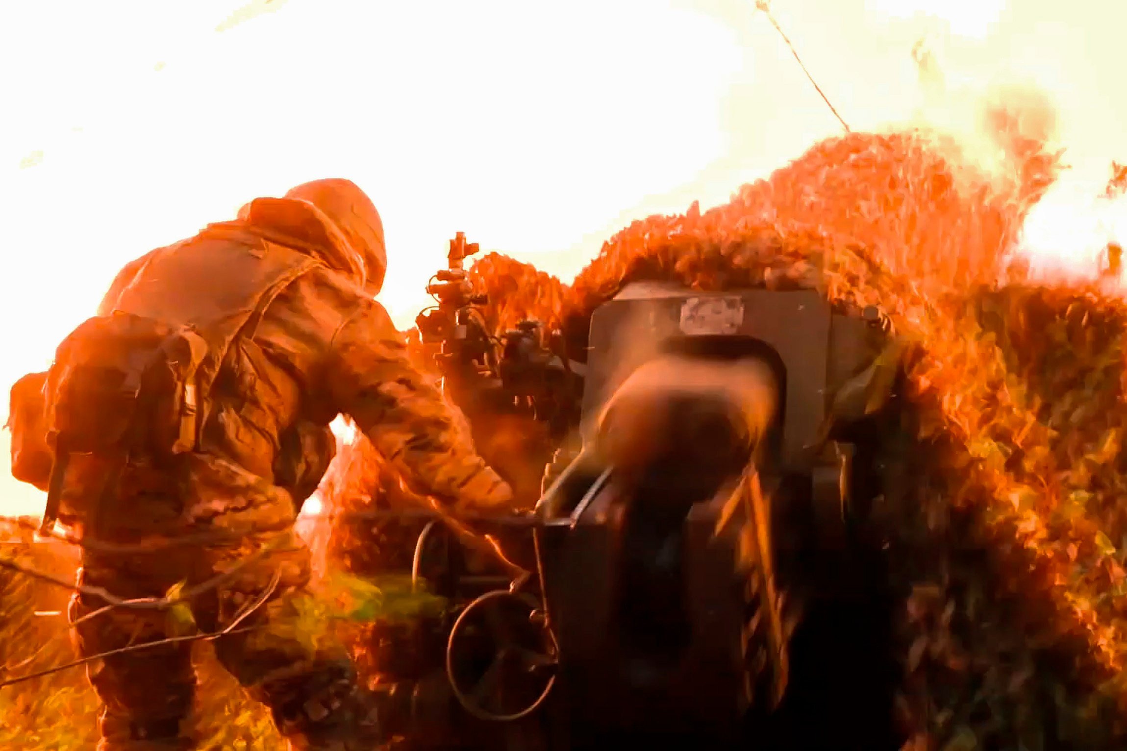 A Russian serviceman fires a D-30 howitzer towards Ukrainian positions in the border area of Kursk region, Russia. Photo: Russian Defence Ministry via AP