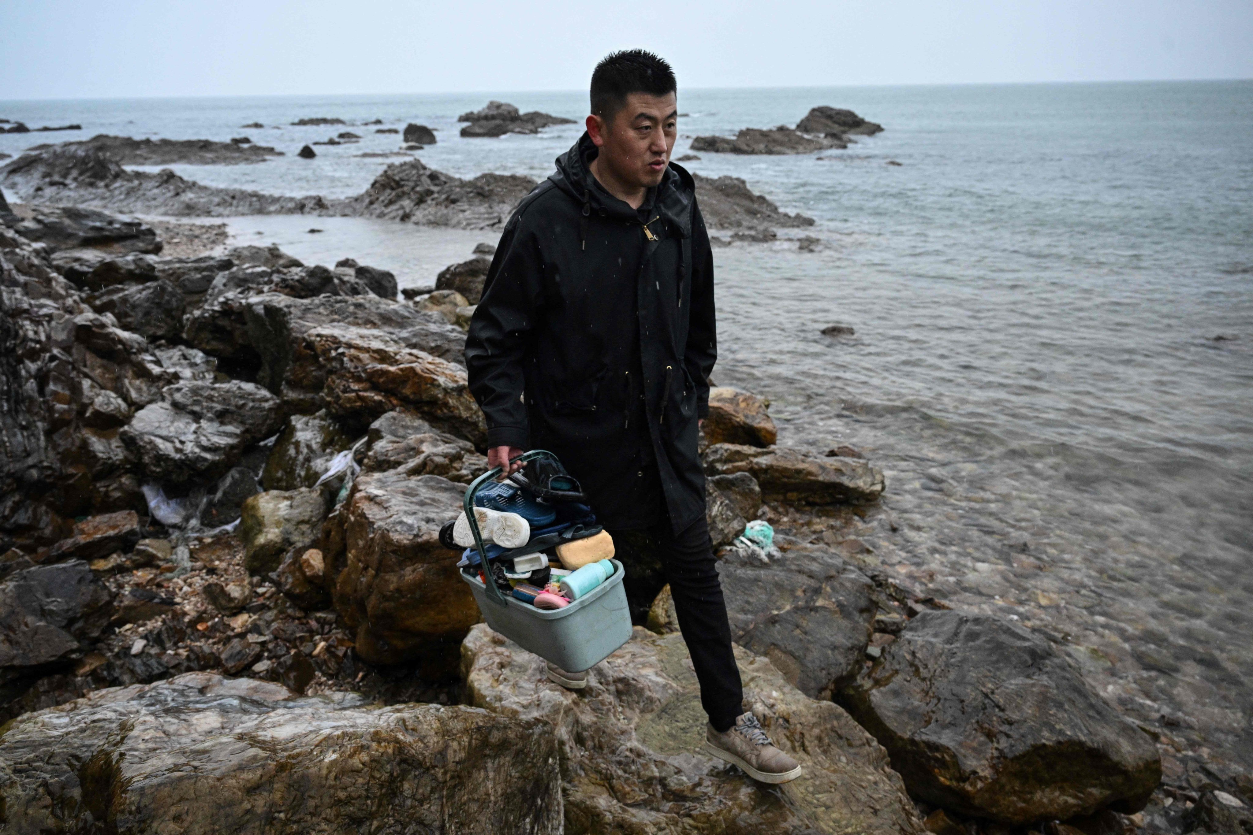 Chinese artist Fu Junsheng transforms plastic waste washed ashore on Miaodao islands into striking art installations. Photo: AFP