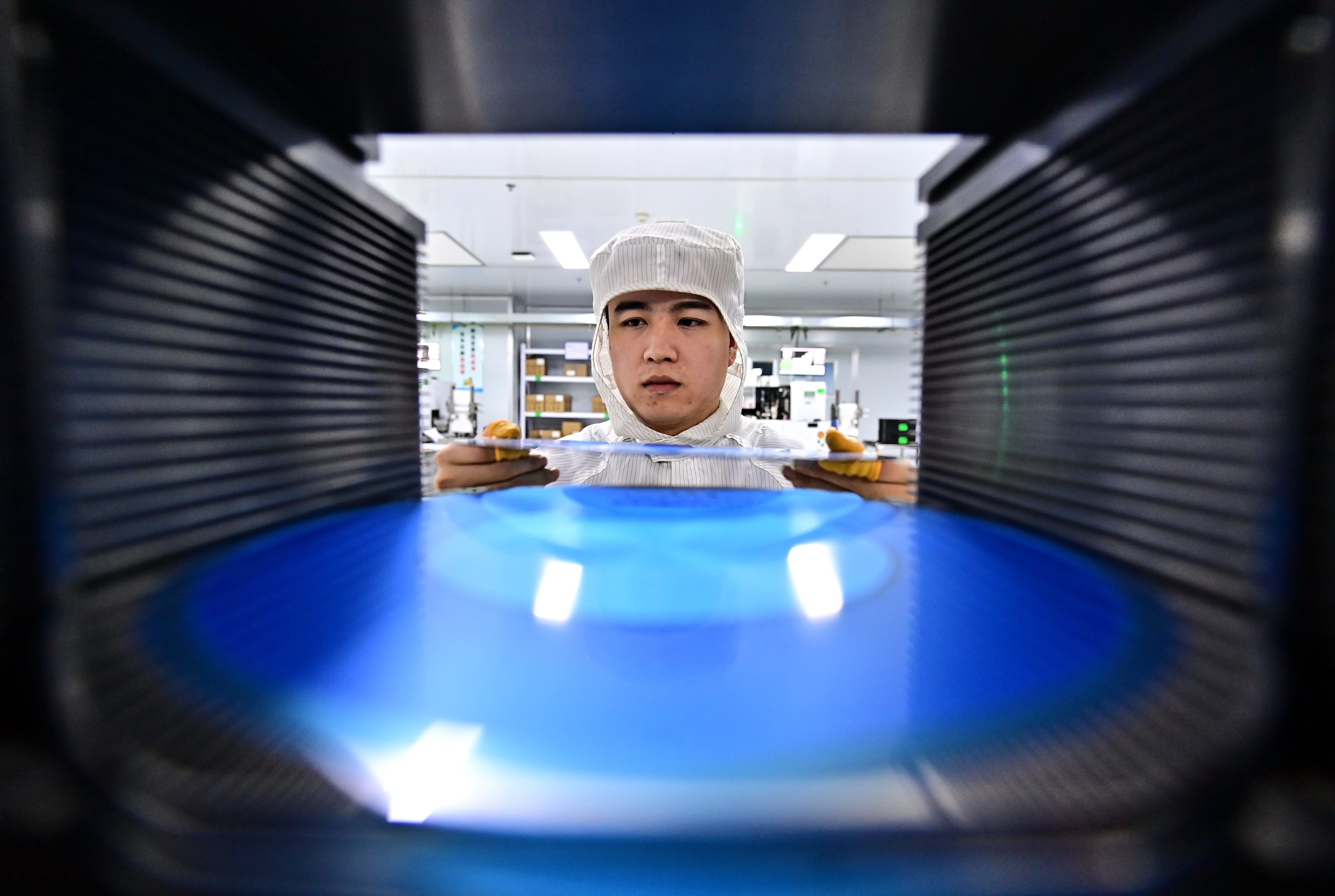 An employee packages semiconductor power devices for export at a workshop in Fuzhou on November 22. Photo: VCG via Getty Images