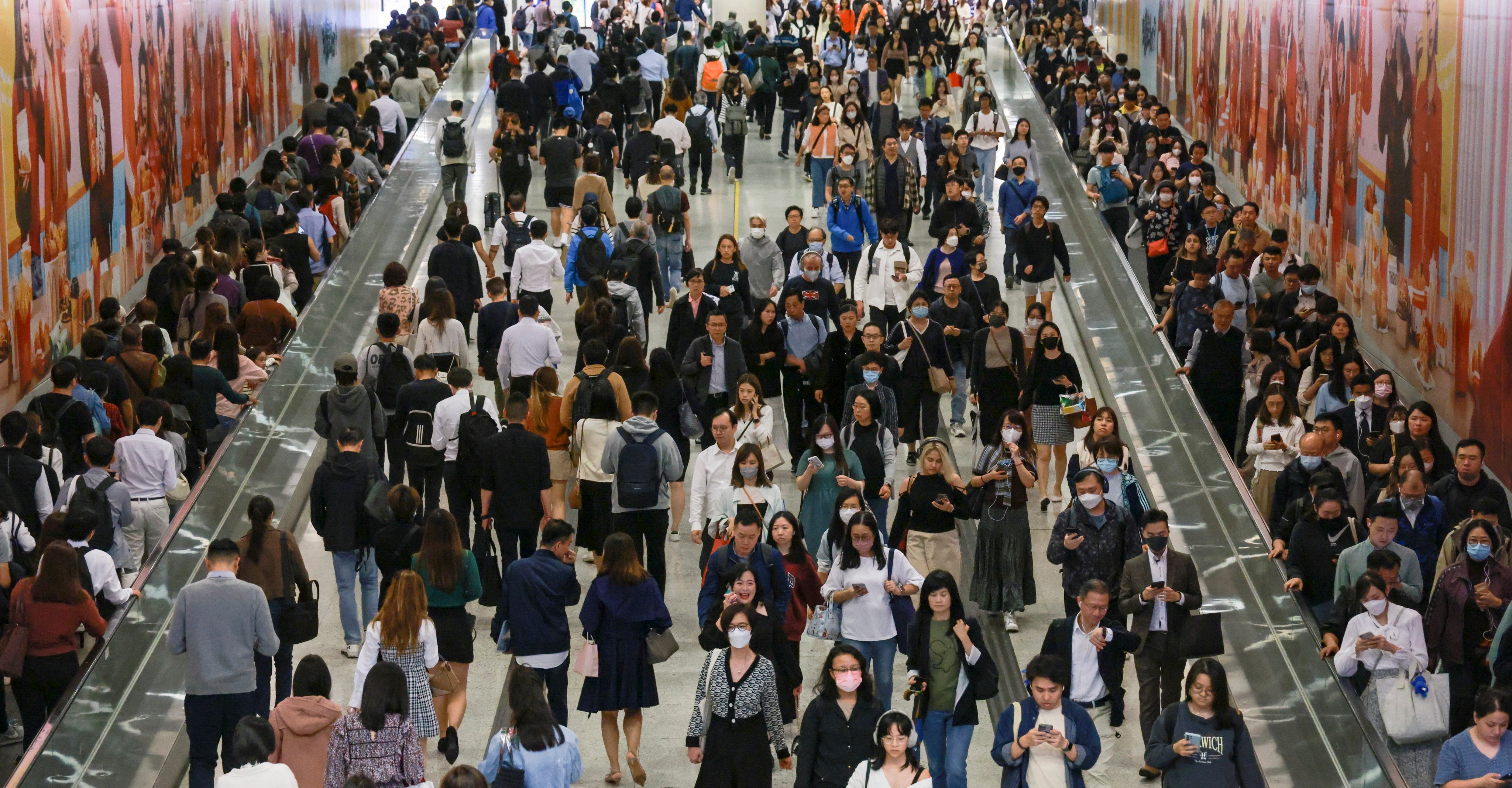 Commuters on the move in Central MTR station in Hong Kong’s business district. Photo: May Tse