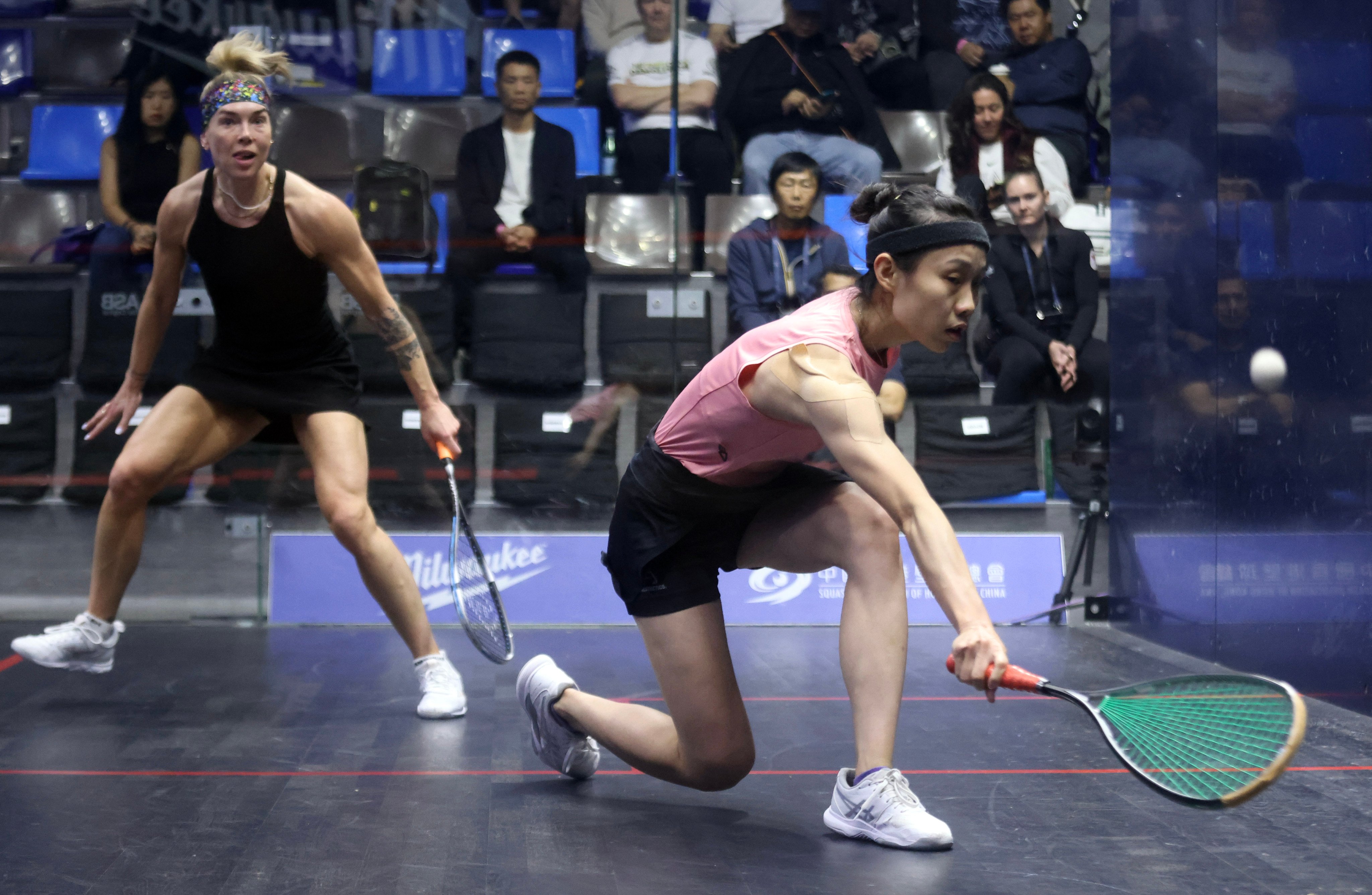 Hong Kong’s top player, Tomato Ho (right), lost to Scotland’s Lisa Aitken in the first round of the Hong Kong Squash Open. Photo: Jonathan Wong