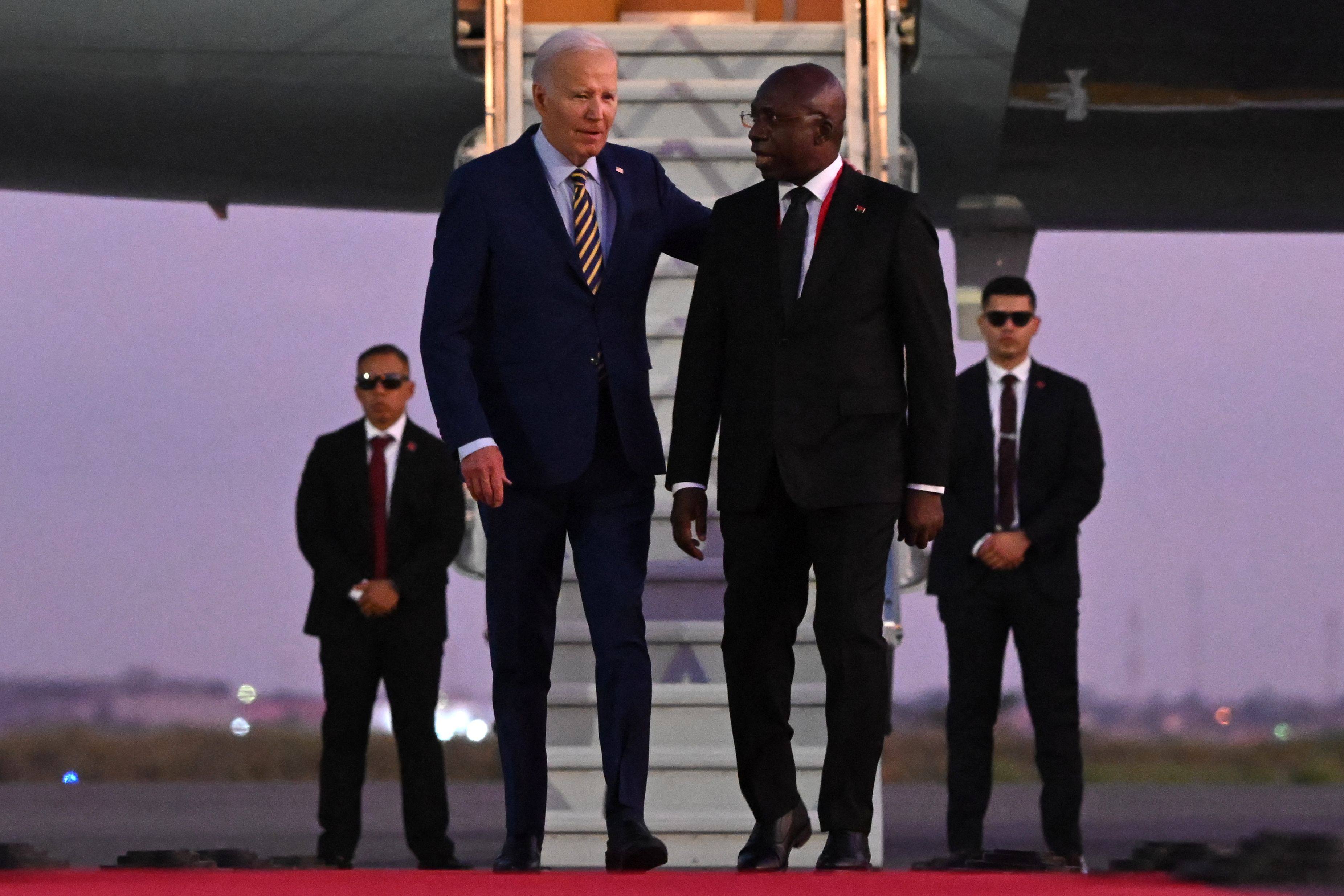 US President Joe Biden on the red carpet next to Angola Foreign Affairs Minister Tete Antonio upon his arrival at the Quatro de Fevereiro Luanda International Airport in Angola’s capital Luanda on Monday. Photo: AFP