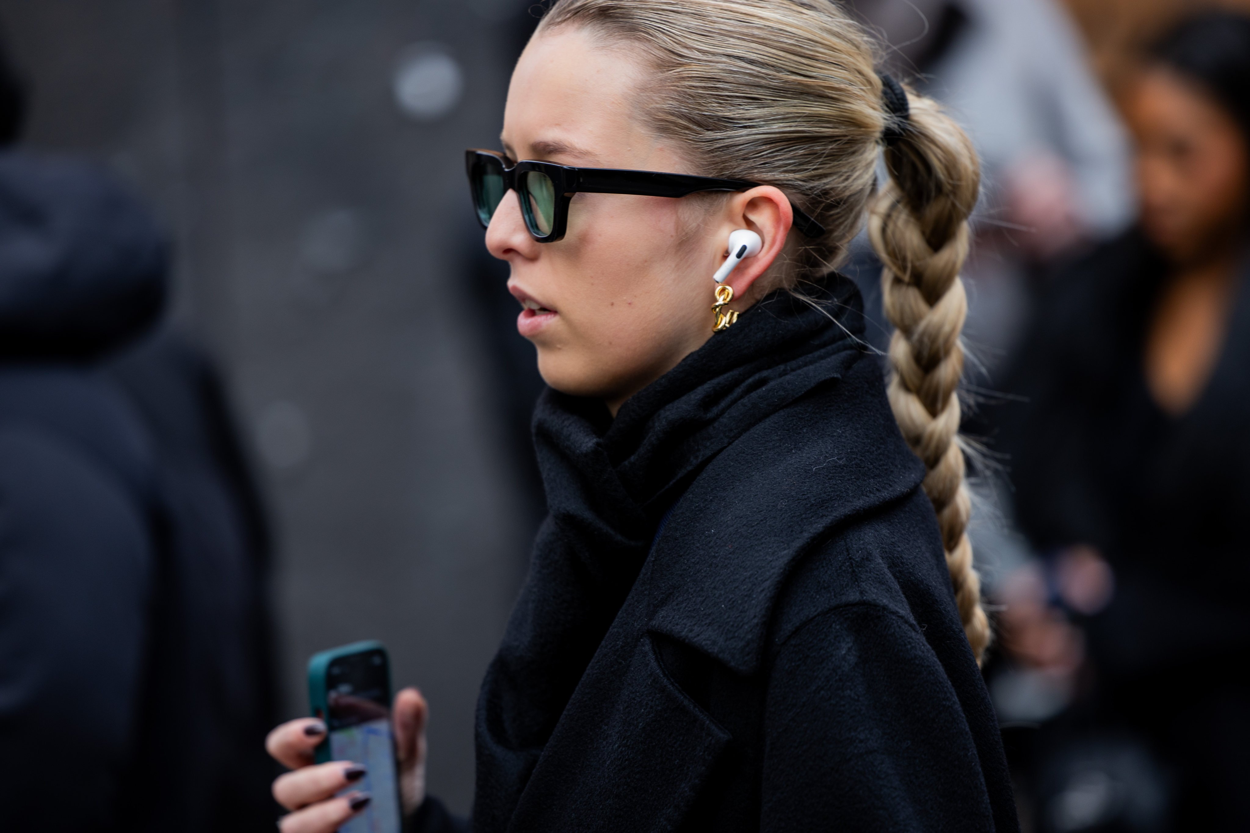 A guest wearing sunglasses and Apple earpods during the Menswear fall/winter 2024-25 as part of  Paris Fashion Week. Photo: Getty Images