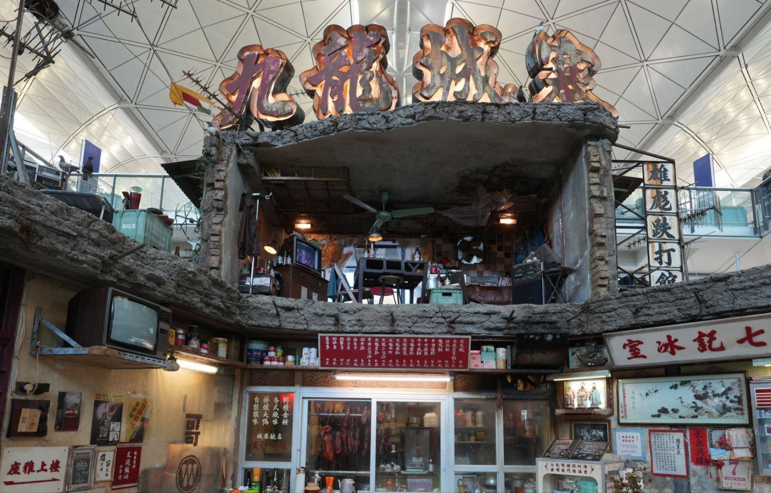 The exhibit features a 6.5-metre-high double-storey set and a large “Kowloon Walled City” neon sign. Photo: Sam Tsang