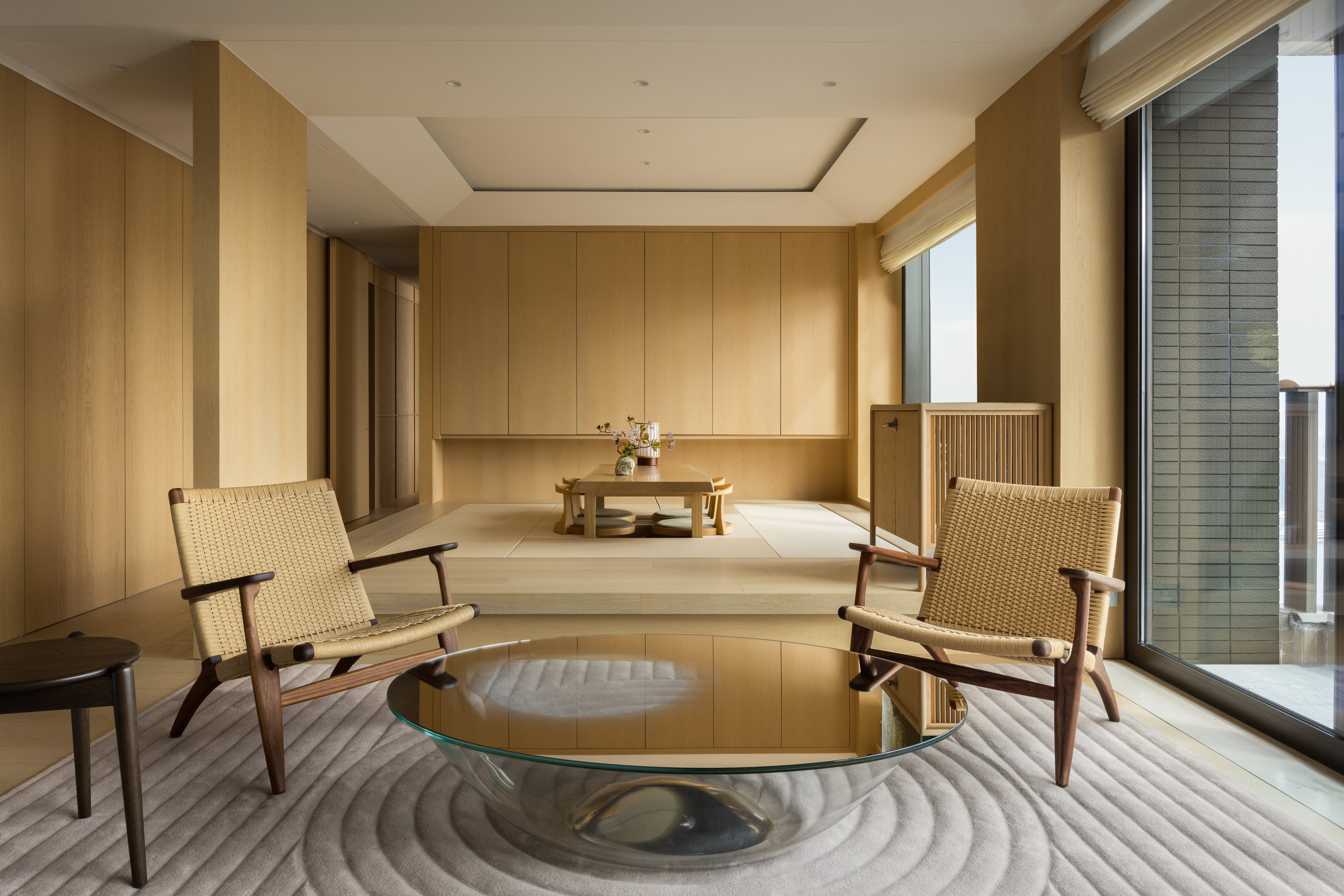 The living room and tea room of the Japanese-style Mid-Levels, Hong Kong, apartment designed by In Situ & Partners. Photo: Luca Bonnefille