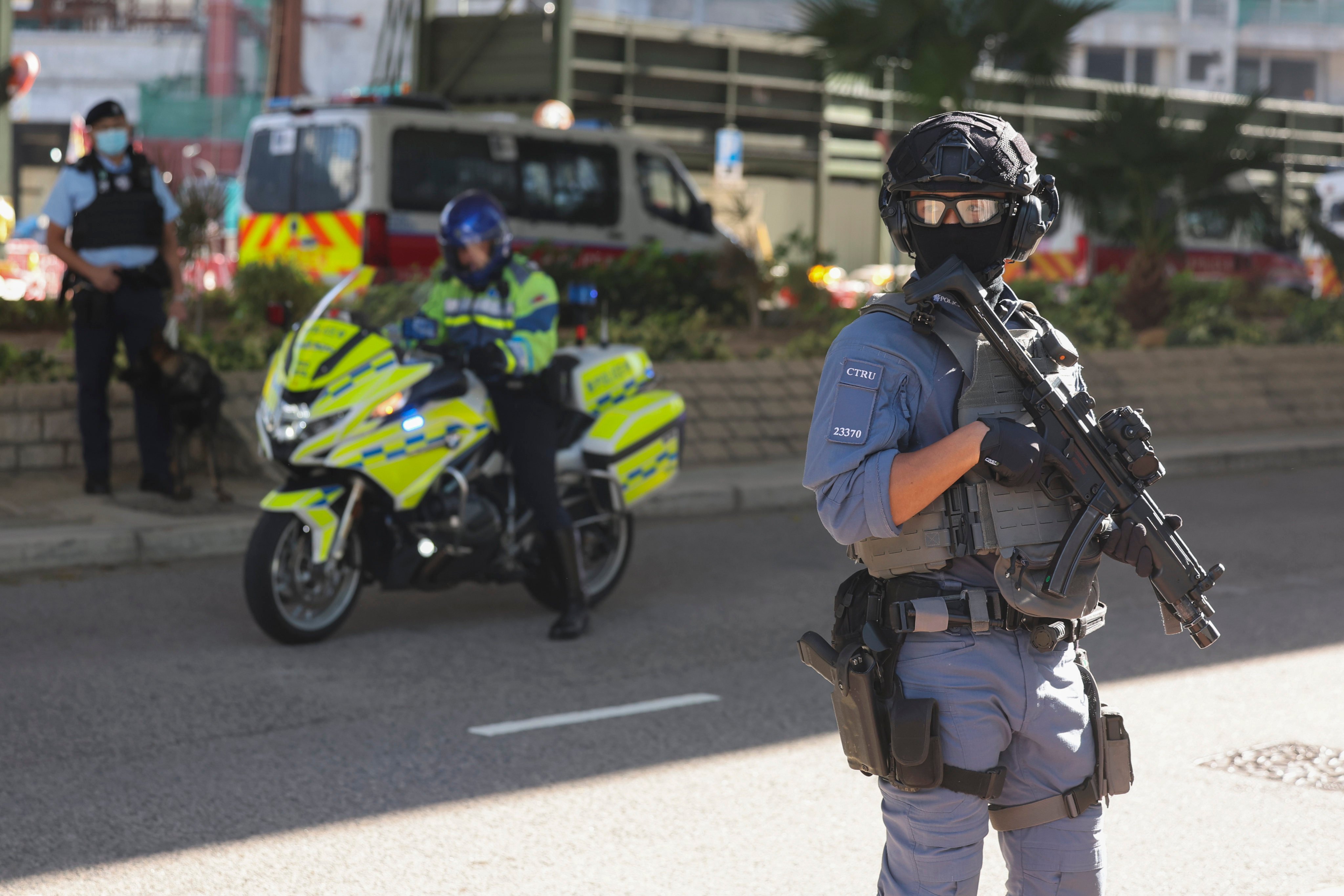 Police officers stand guard outside West Kowloon Court. Photo: Edmond So