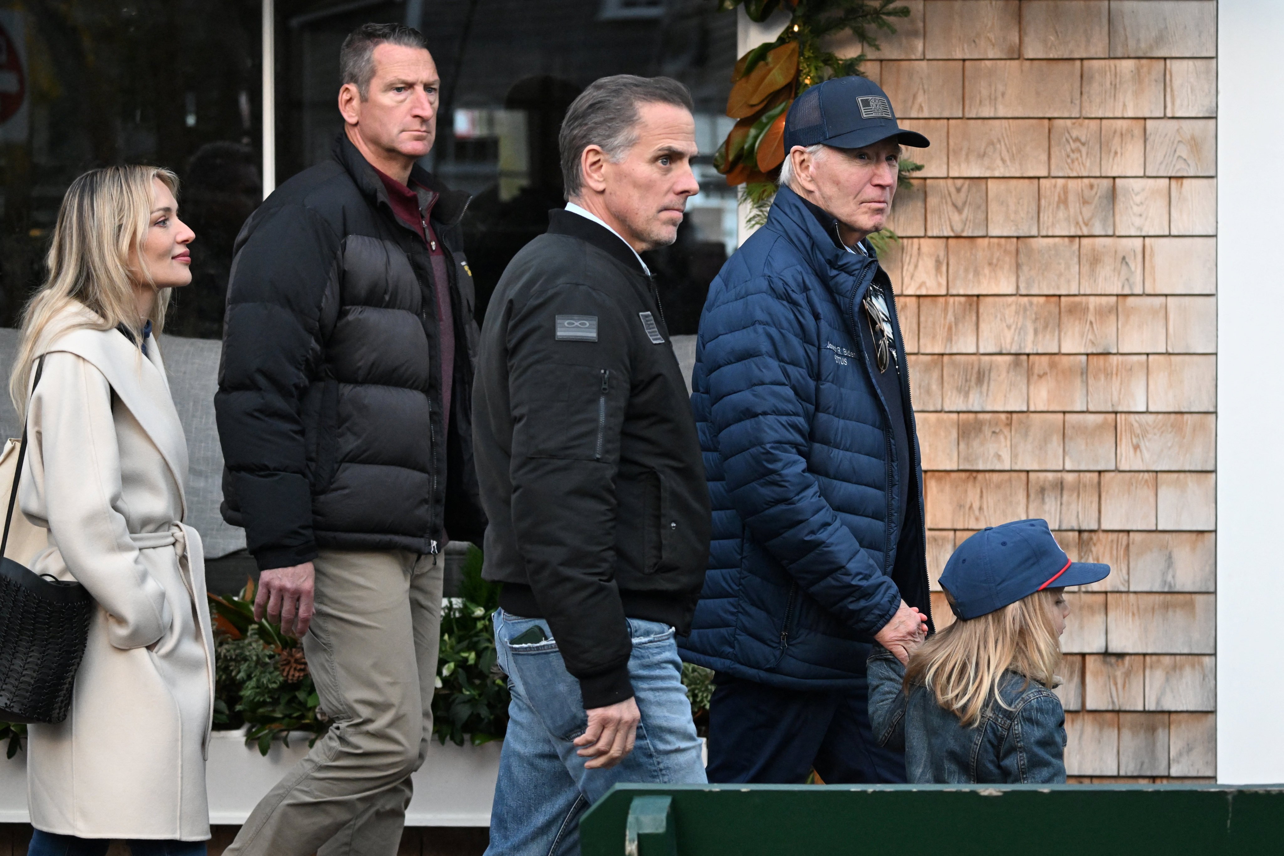 US President Joe Biden walks in downtown Nantucket, Massachusetts, on November 29 with his son Hunter, grandson Beau Jnr and daughter-in-law Melissa Cohen Biden. Photo: Reuters 