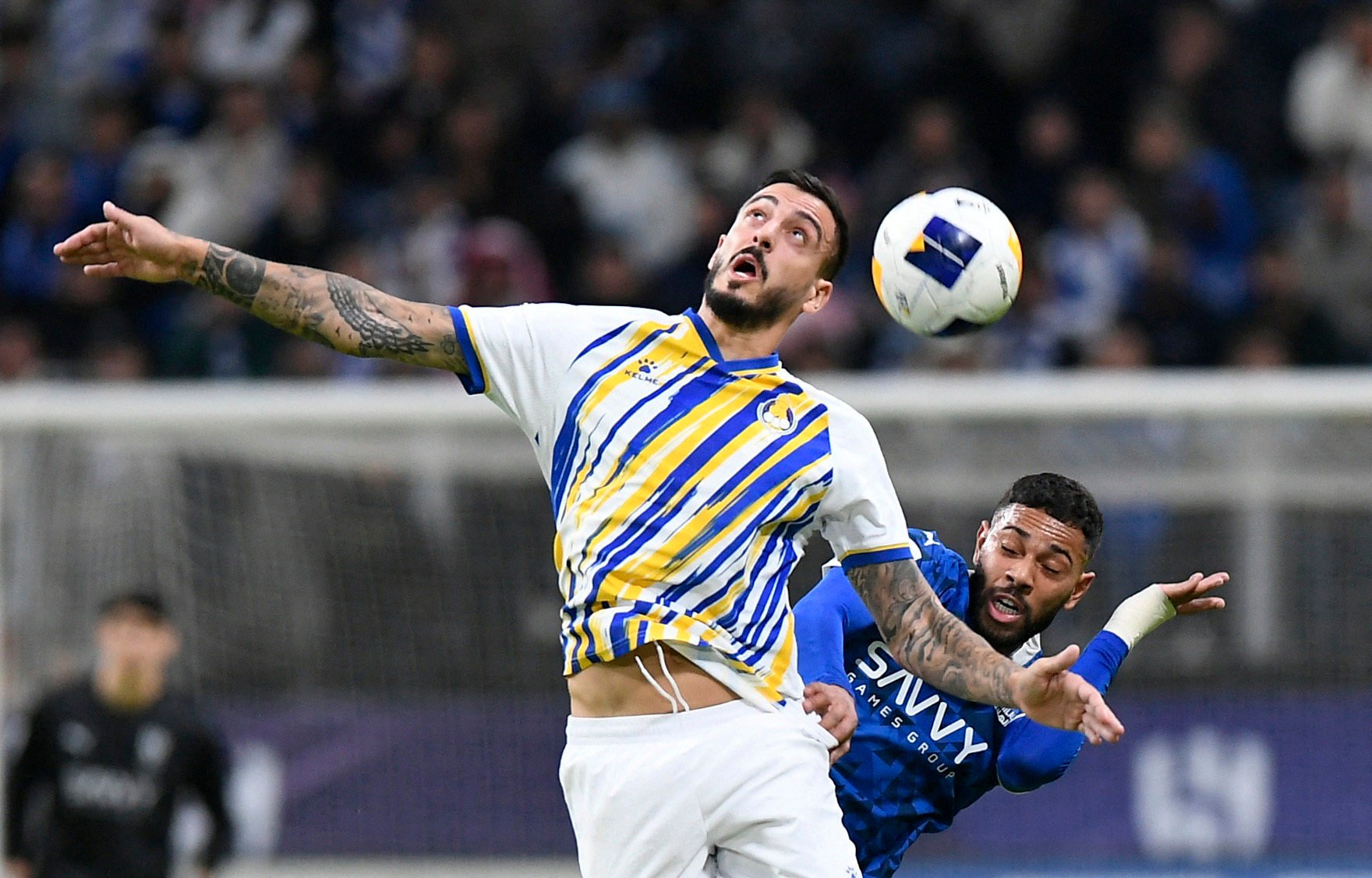 Al Gharafa’s Joselu (left) in a tussle with Al-Hilal’s Renan Lodi, whose team won 3-0 to go to the top of the western zone of the Asian Champions League Elite. Photo: Reuters