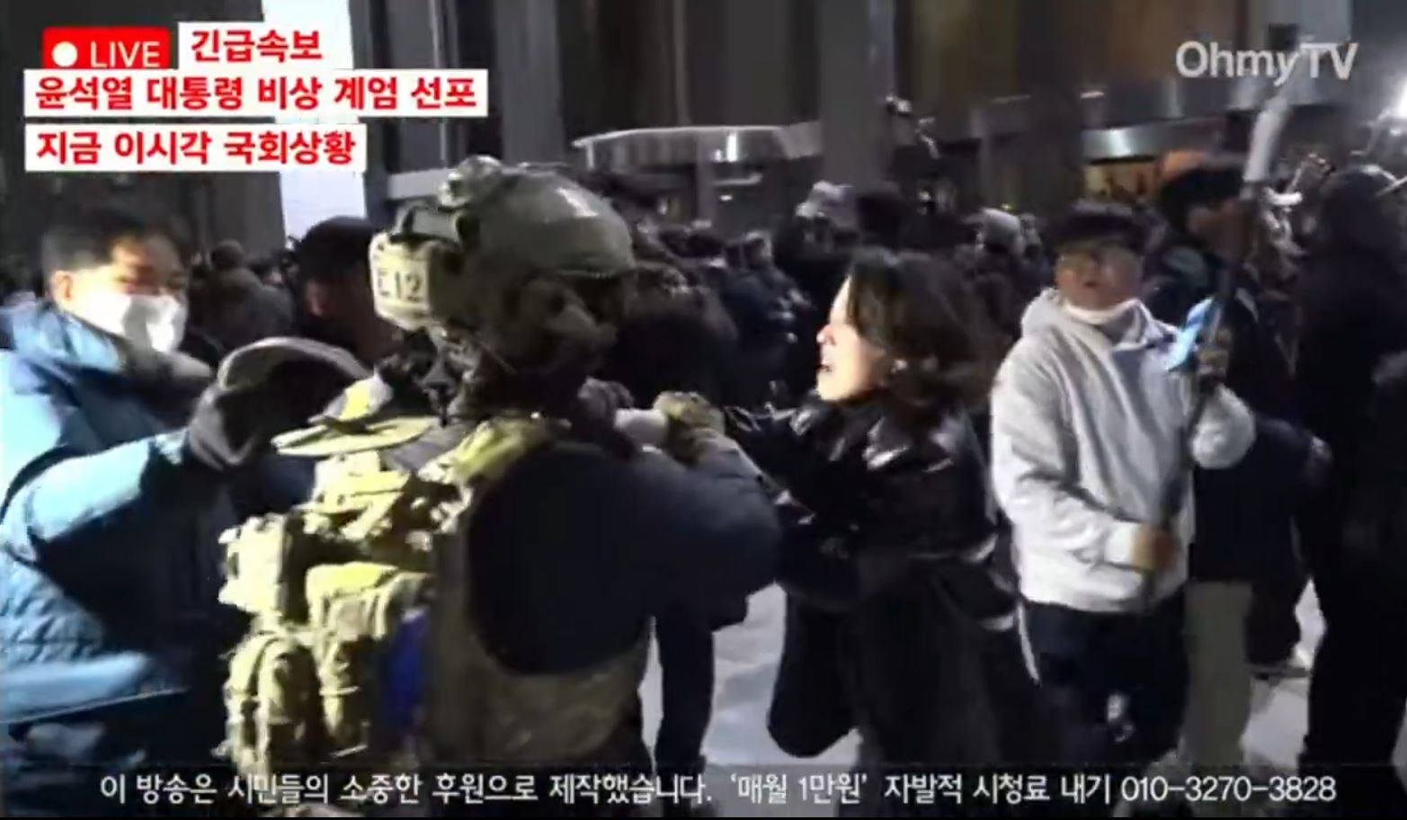 Ahn Gwi-ryeong tussles with a South Korean soldier in Seoul on Tuesday. Photo: X/youlu_v0v