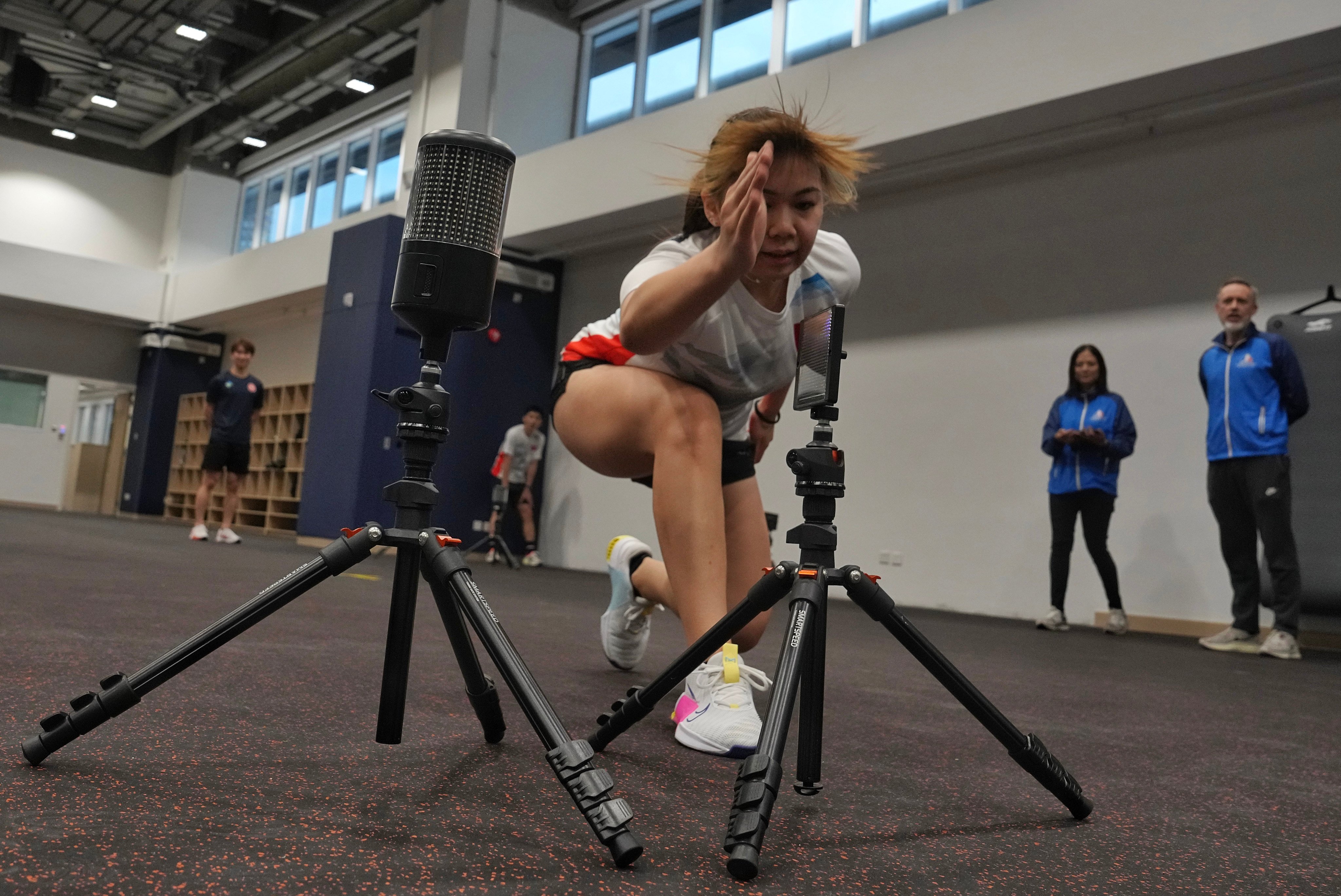 An athlete is put through her paces in the fitness training centre at the New Facilities Building at the Hong Kong Sports Institute. Photo: Elson Li