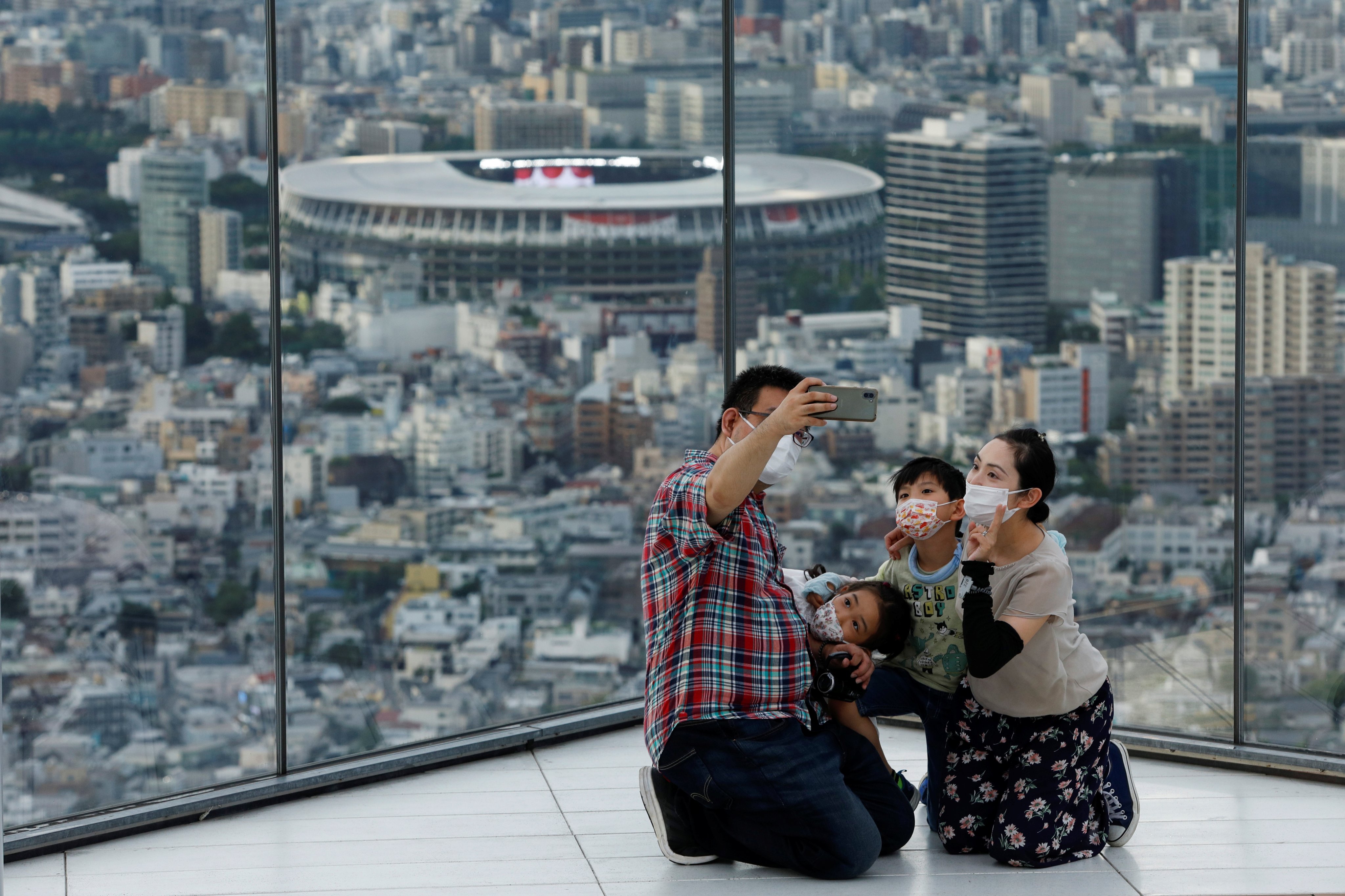 A family at Tokyo’s Shibuya Sky. While many developed countries are struggling with low birth rates, the problem is particularly acute in Japan where the population has declined for 15 straight years. Photo: Reuters