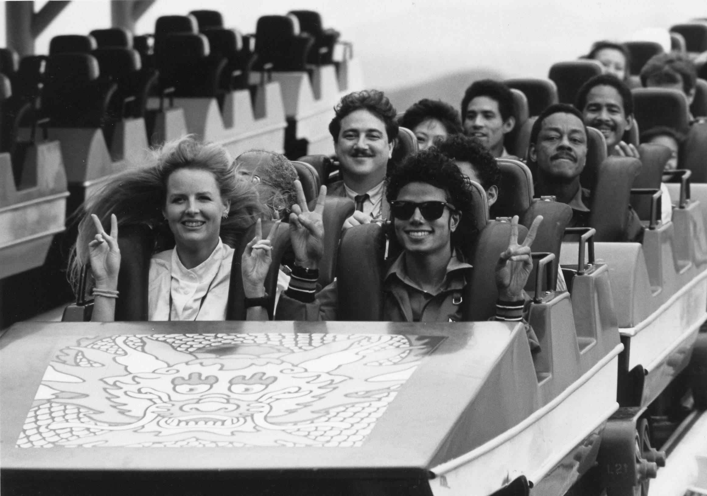 Michael Jackson, his minders and other visitors taking a roller coaster ride at Ocean Park during the pop superstar’s private trip to Hong Kong in 1987. Entertainer Dr Penguin (with moustache) sits behind him. Photo: SCMP
