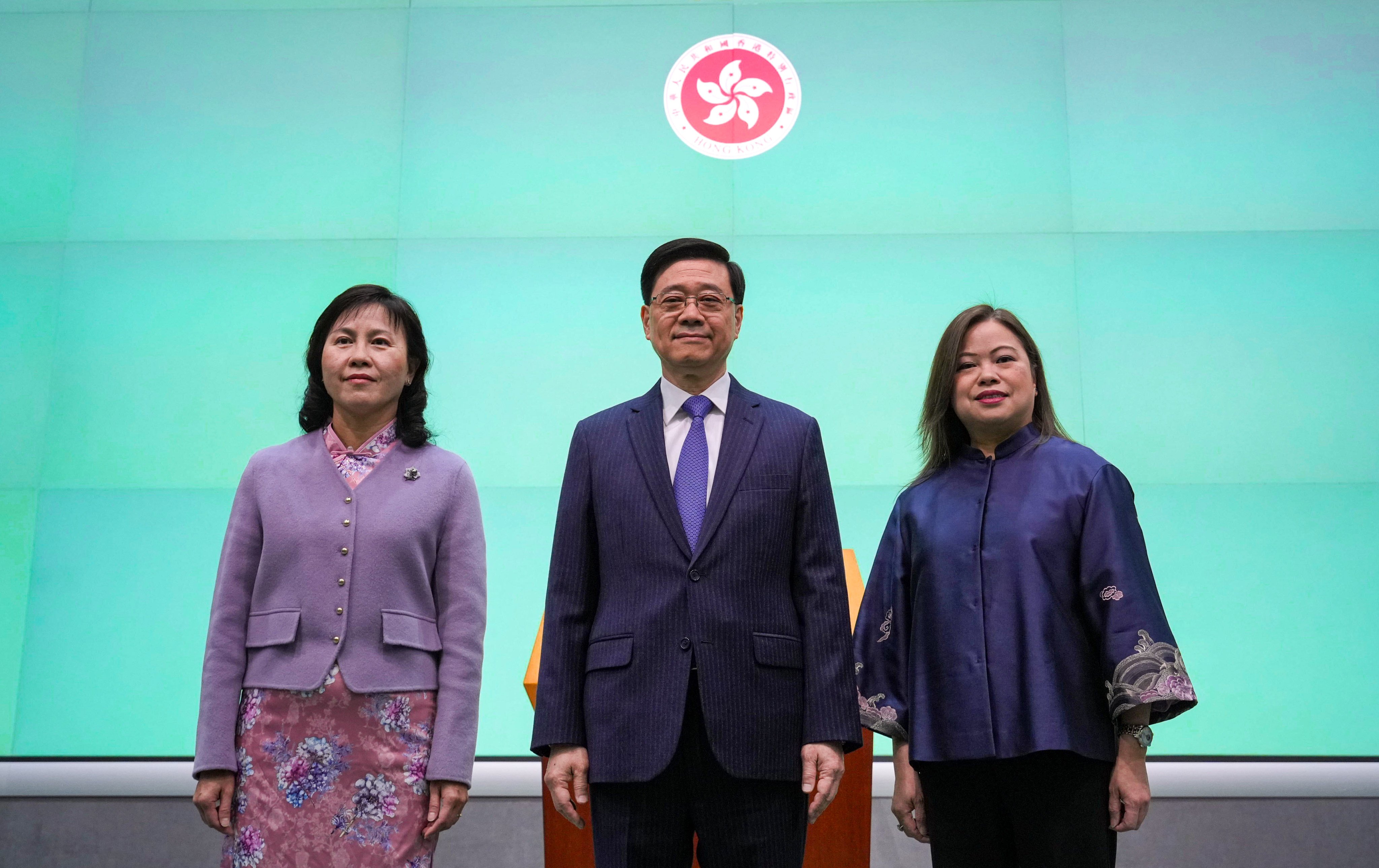 Newly appointed Hong Kong transport minister Mable Chan (left) with Chief Executive John Lee Ka-chiu and new tourism secretary Rosanna Law on Thursday. Photo: May Tse