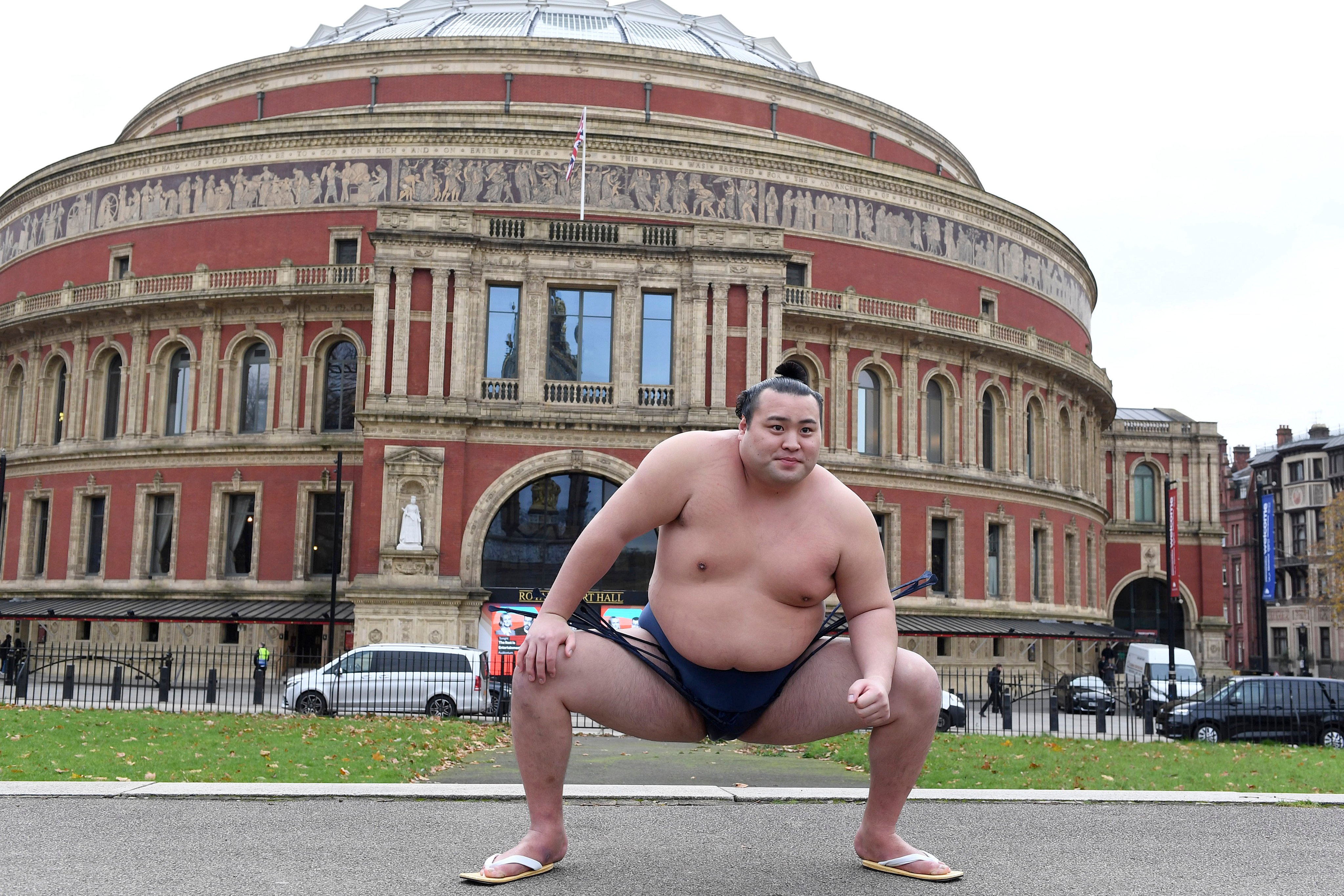 Sumo wrestler Daisuke Kitanowaka makes a stand outside London’s Royal Albert Hall, which will host a “basho” for the second time next year. Photo: AP