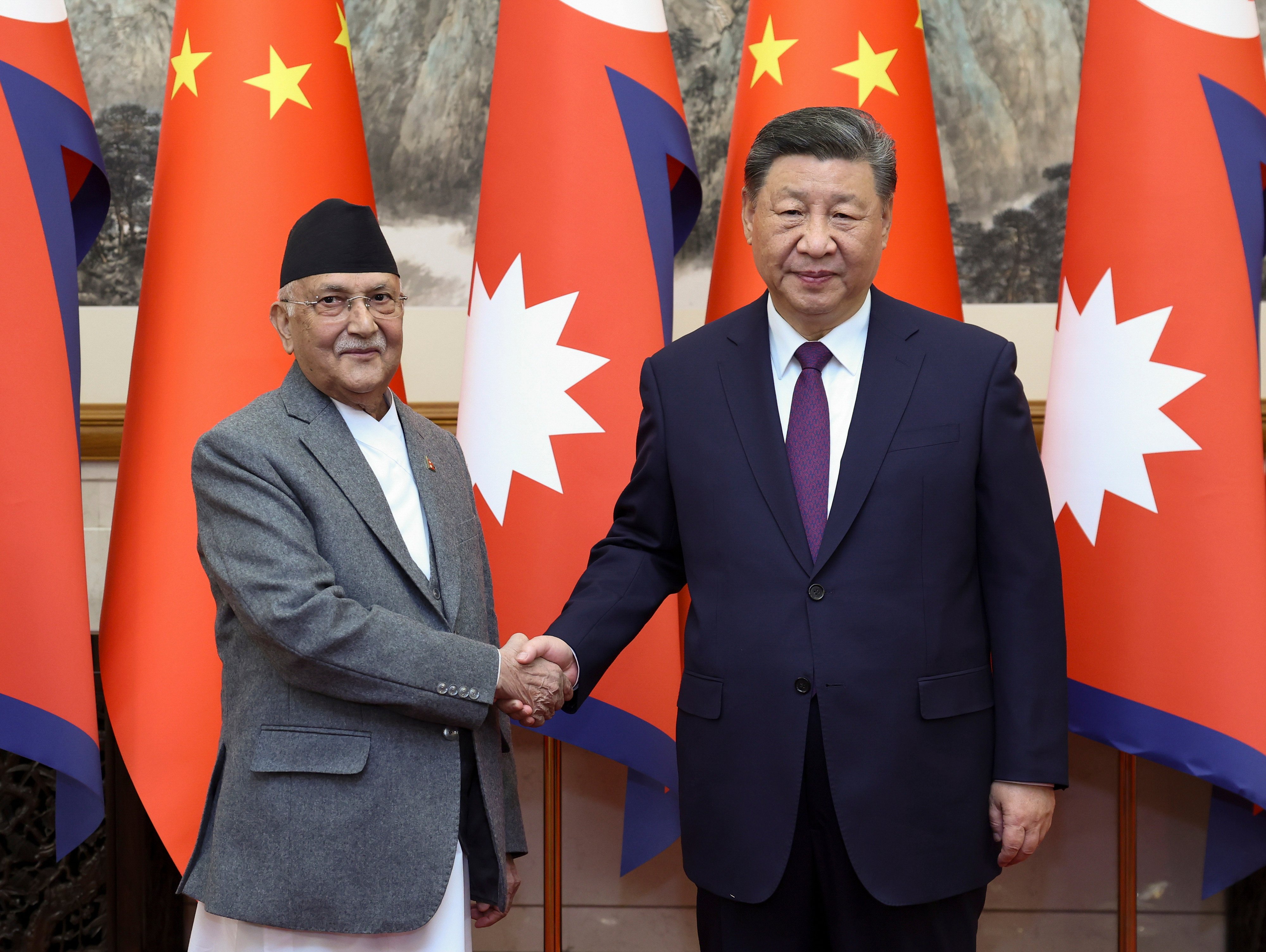 Nepal’s Prime Minister K.P. Sharma Oli (left), shakes hands with Chinese President Xi Jinping at the Great Hall of the People in Beijing on December 3. Photo: Xinhua/AP