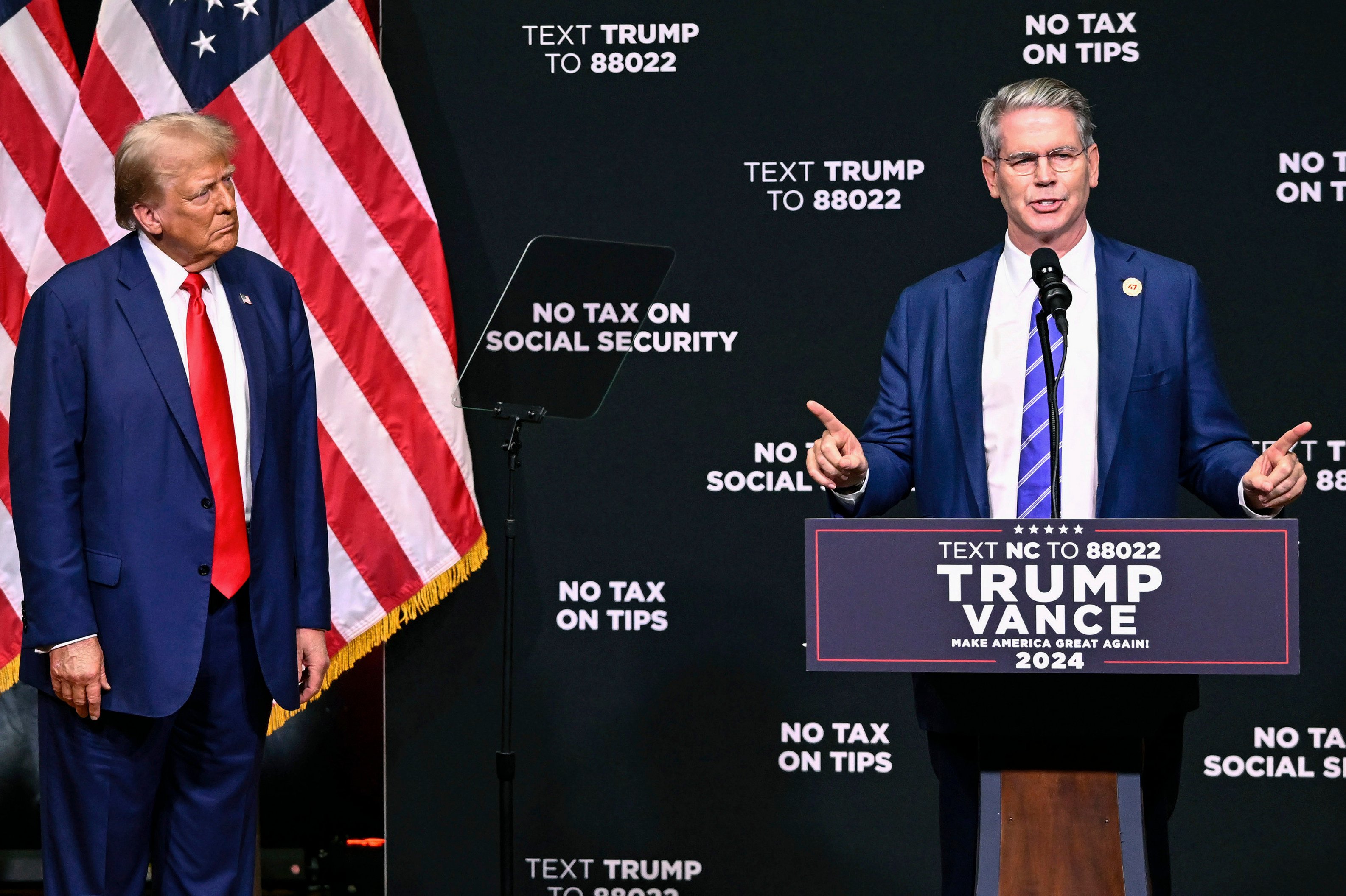 Donald Trump, then Republican presidential nominee, listens as hedge fund manager Scott Bessent speaks on the economy in Asheville, North Carolina, on August 14. Bessent is Trump’s pick for Treasury secretary. Photo: AP 