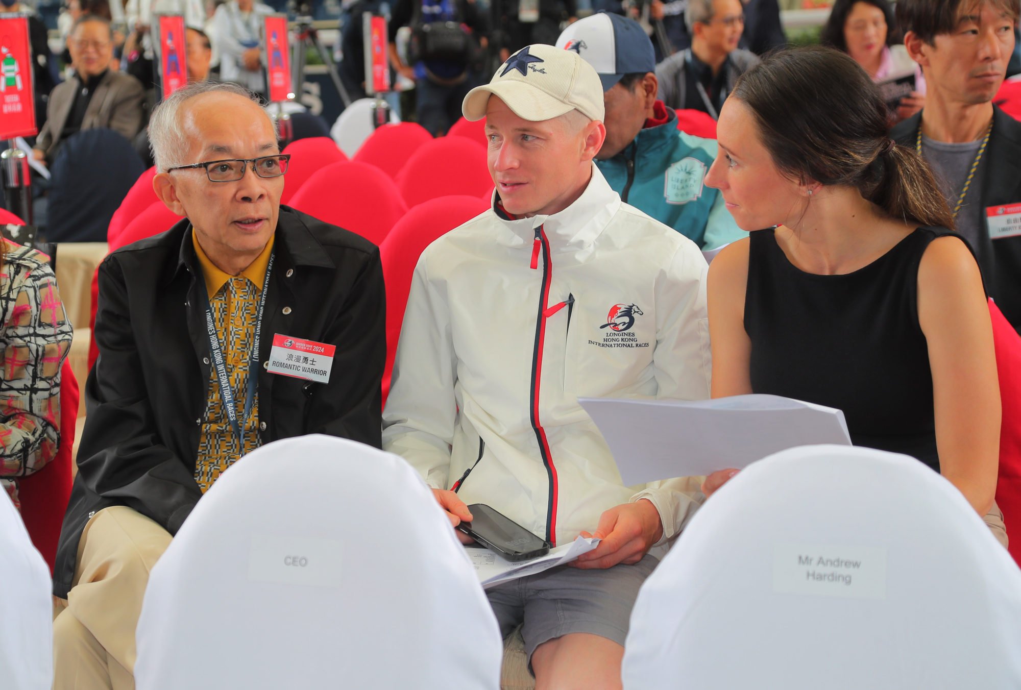 Romantic Warrior’s owner Peter Lau (left) with jockey James McDonald and his wife Katelyn at Thursday’s draw.