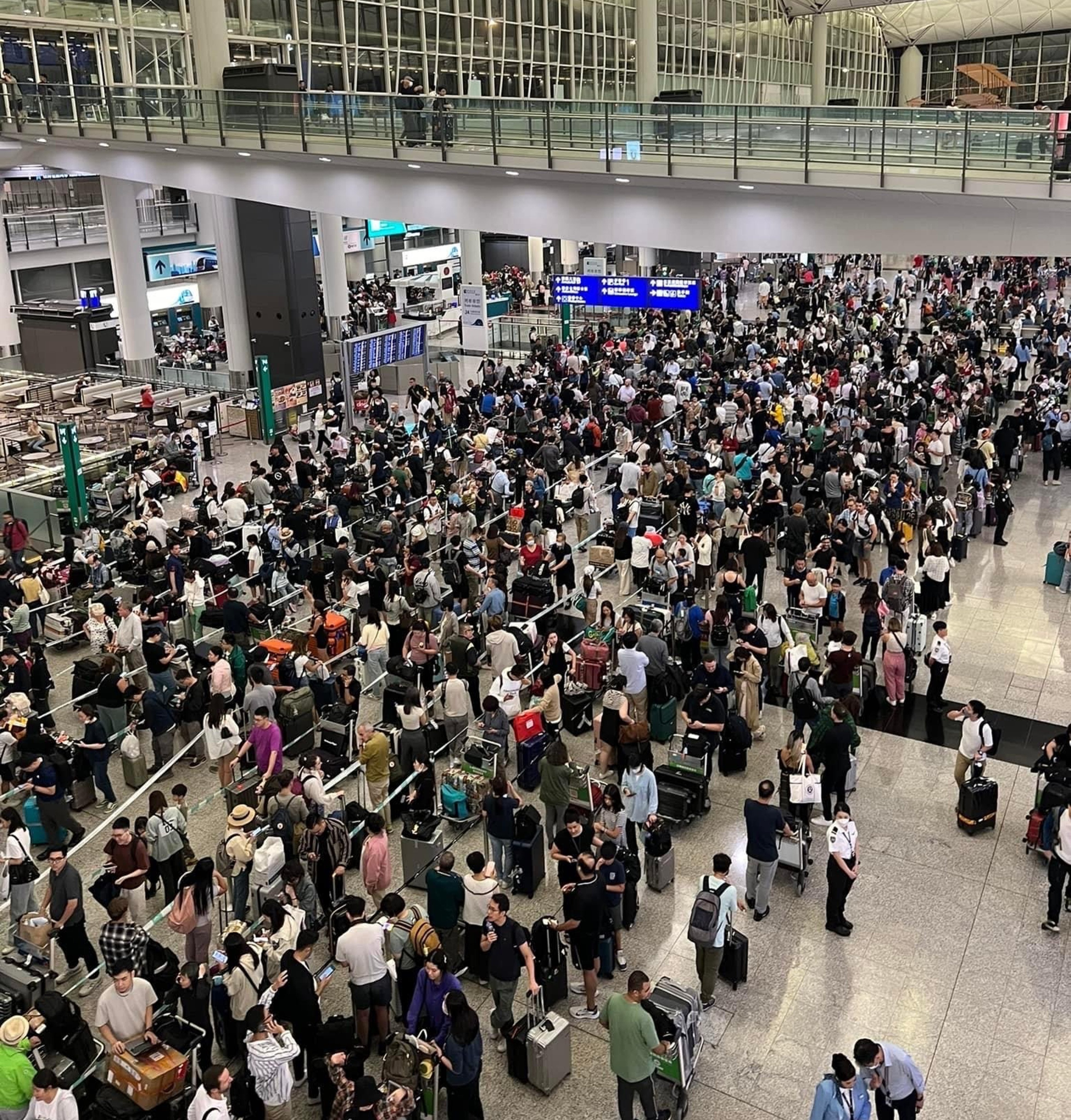 Passengers are stranded at Hong Kong International Airport amid a No 9 typhoon warning signal in October. Photo: Handout