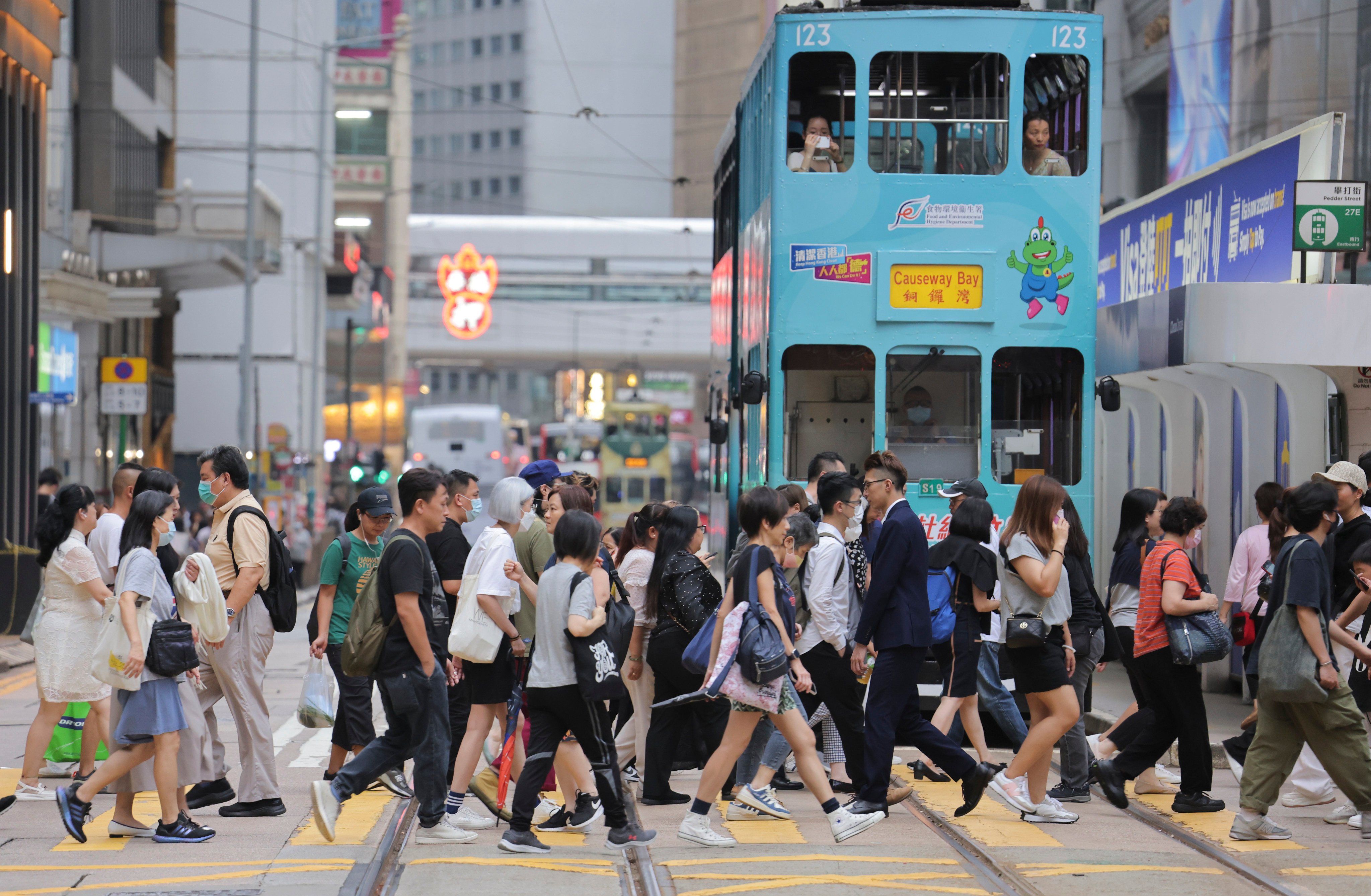 People cross a road in Central on August 17, 2023. Photo: Jelly Tse