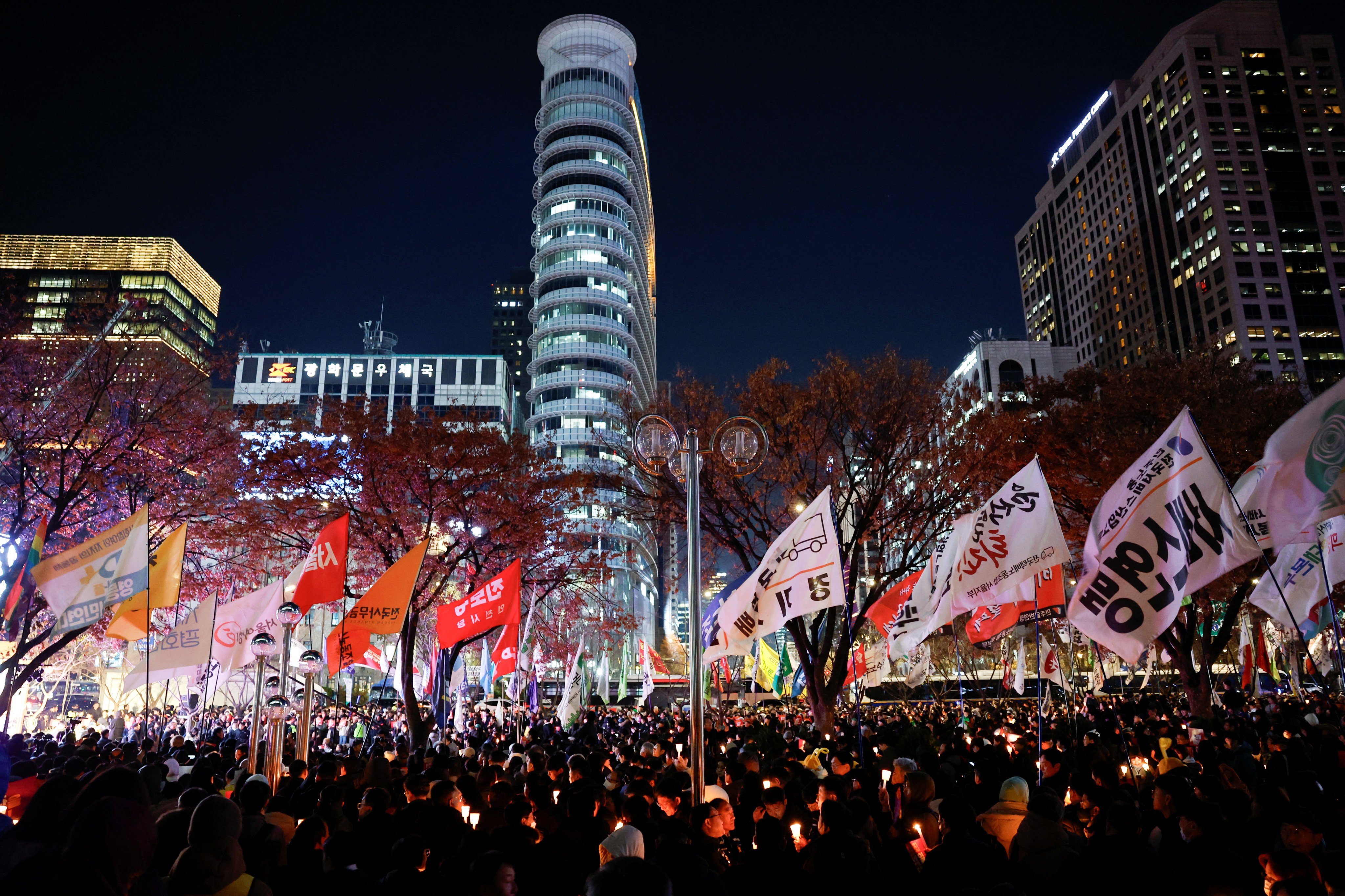 South Koreans attend a candlelight vigil condemning President Yoon Suk-yeol’s declaration of martial law in Seoul. Photo: Reuters