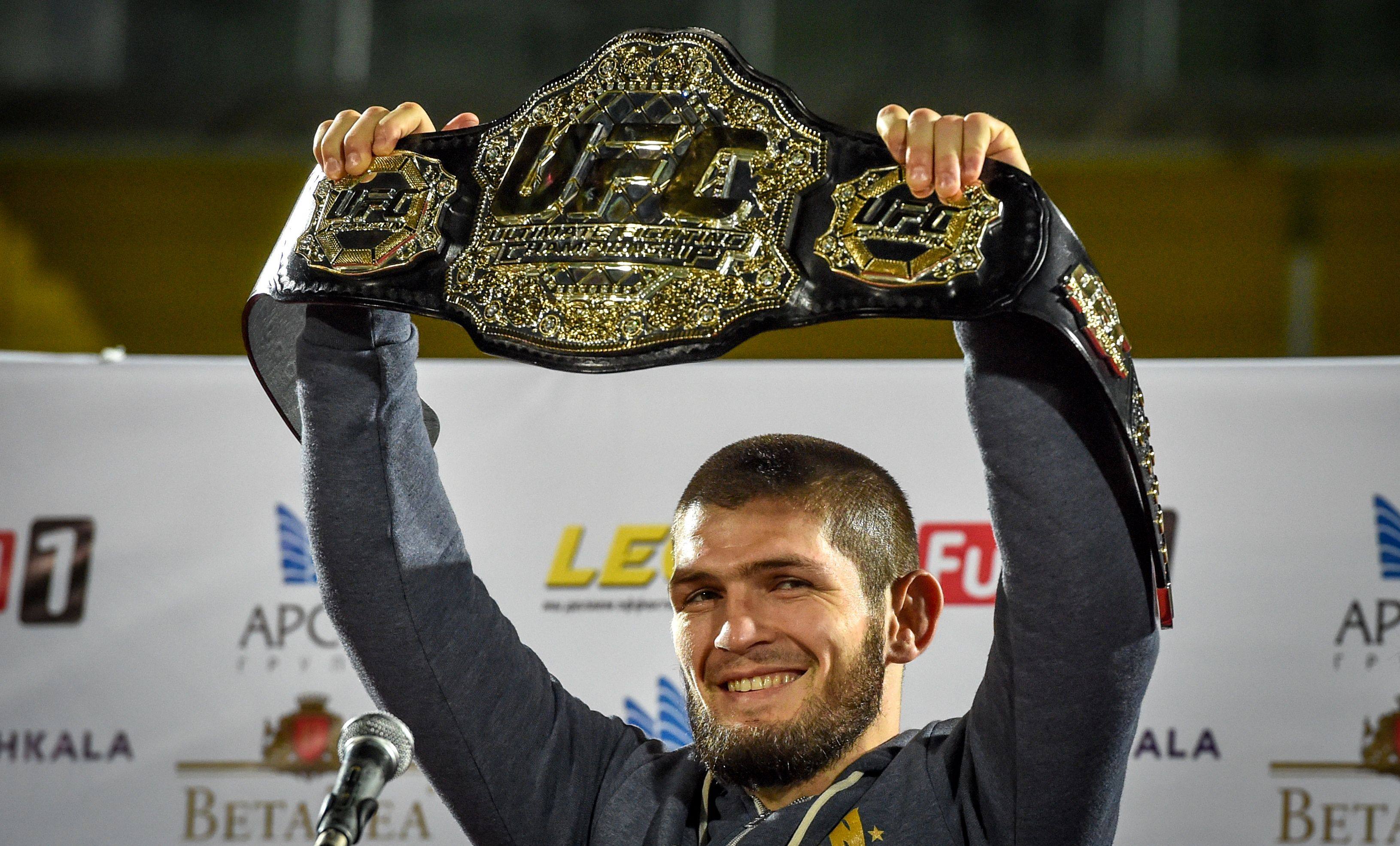 UFC lightweight champion Khabib Nurmagomedov of Russia raises his champions belt in the city of Makhachkala in 2018. Photo: AFP 