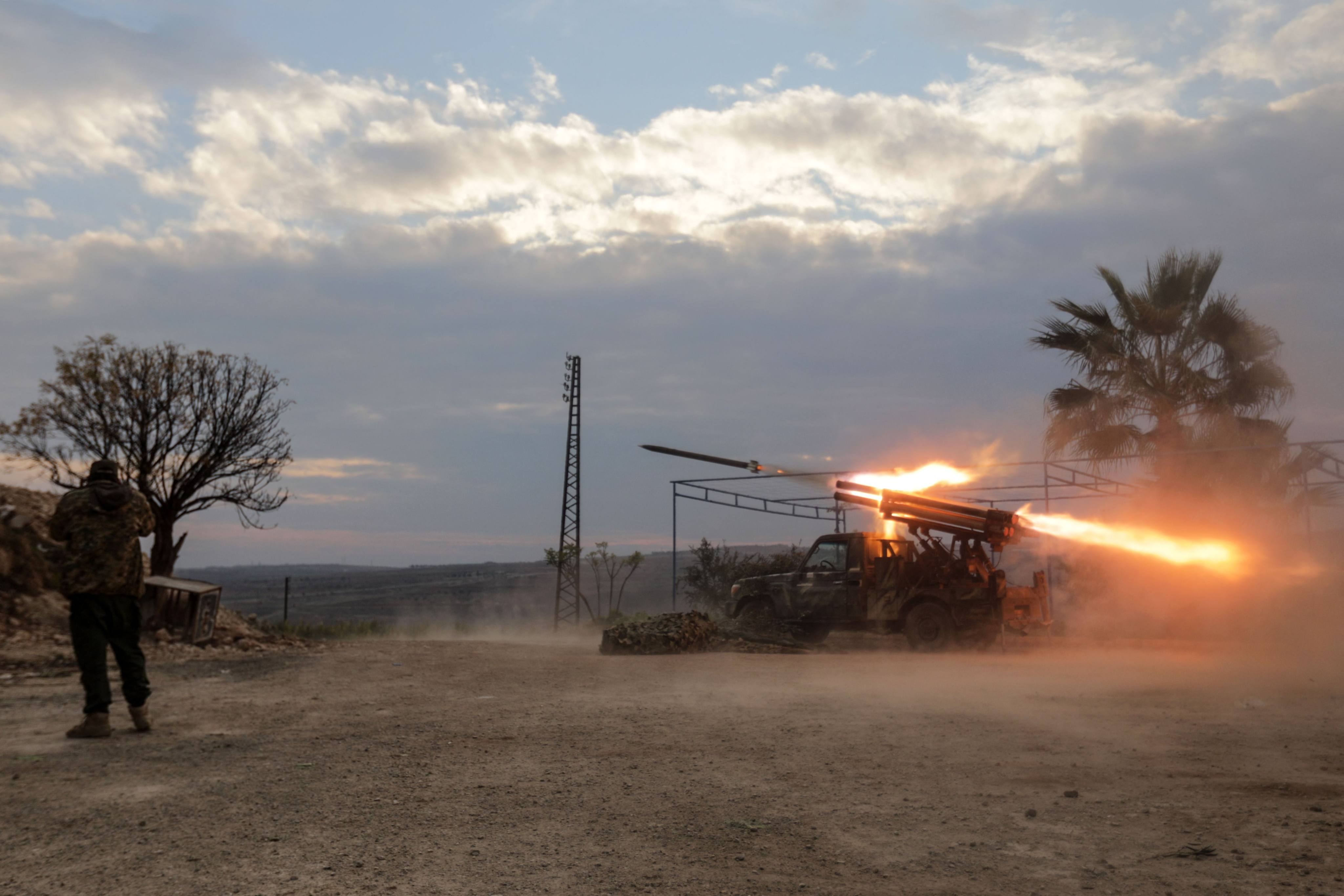 A multi-barrel rocket launcher fires against regime forces, in the northern outskirts of Syria’s west-central city of Hama. Photo: AFP