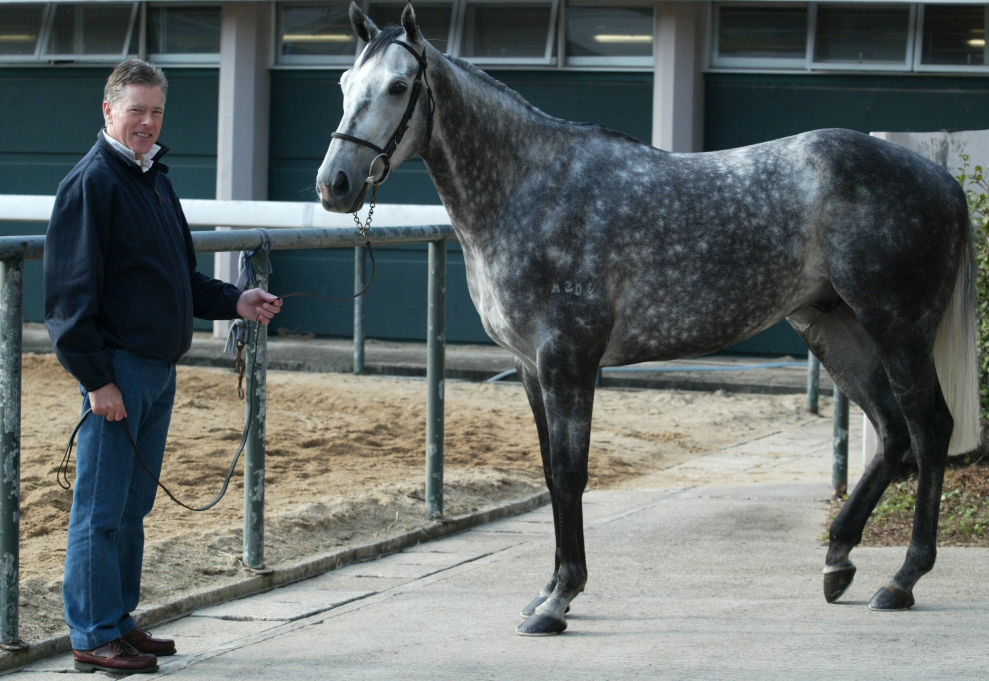 Harry and David Eustace’s uncle, David Oughton, poses with Precision at Sha Tin in 2003.